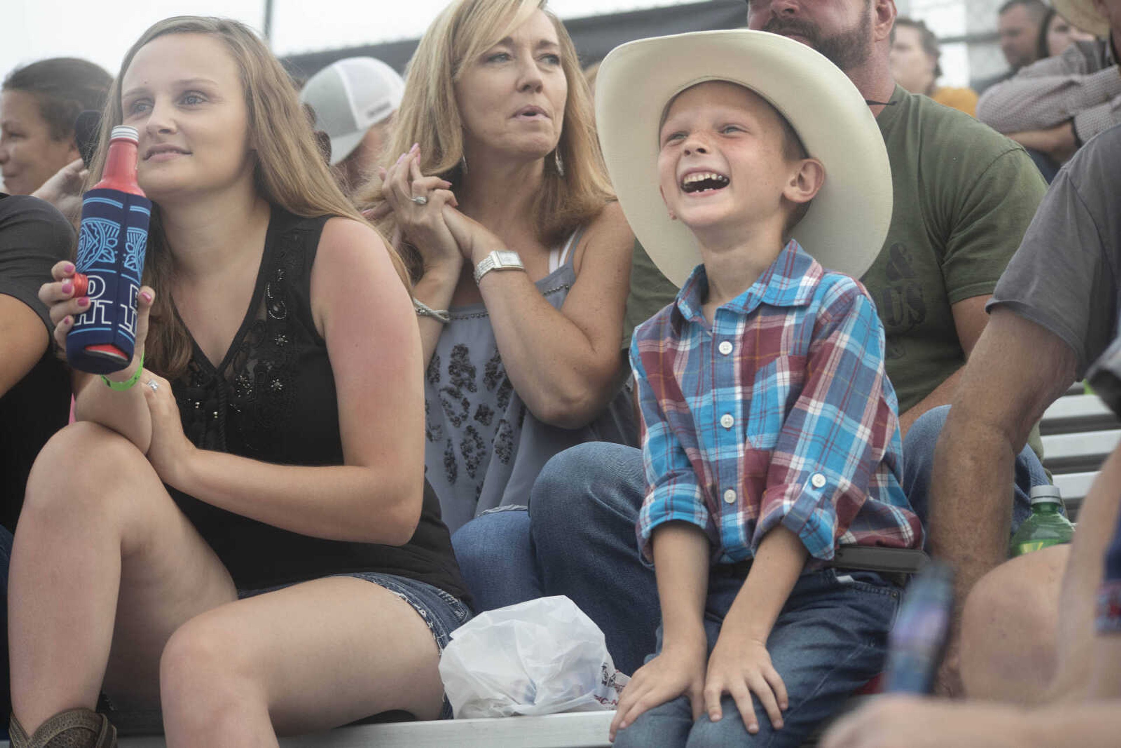 A young boy smiles while watching performers at the Sikeston Jaycees Bootheel Rodeo Friday, Aug. 13, 2021,&nbsp;&nbsp;in Sikeston, Missouri.