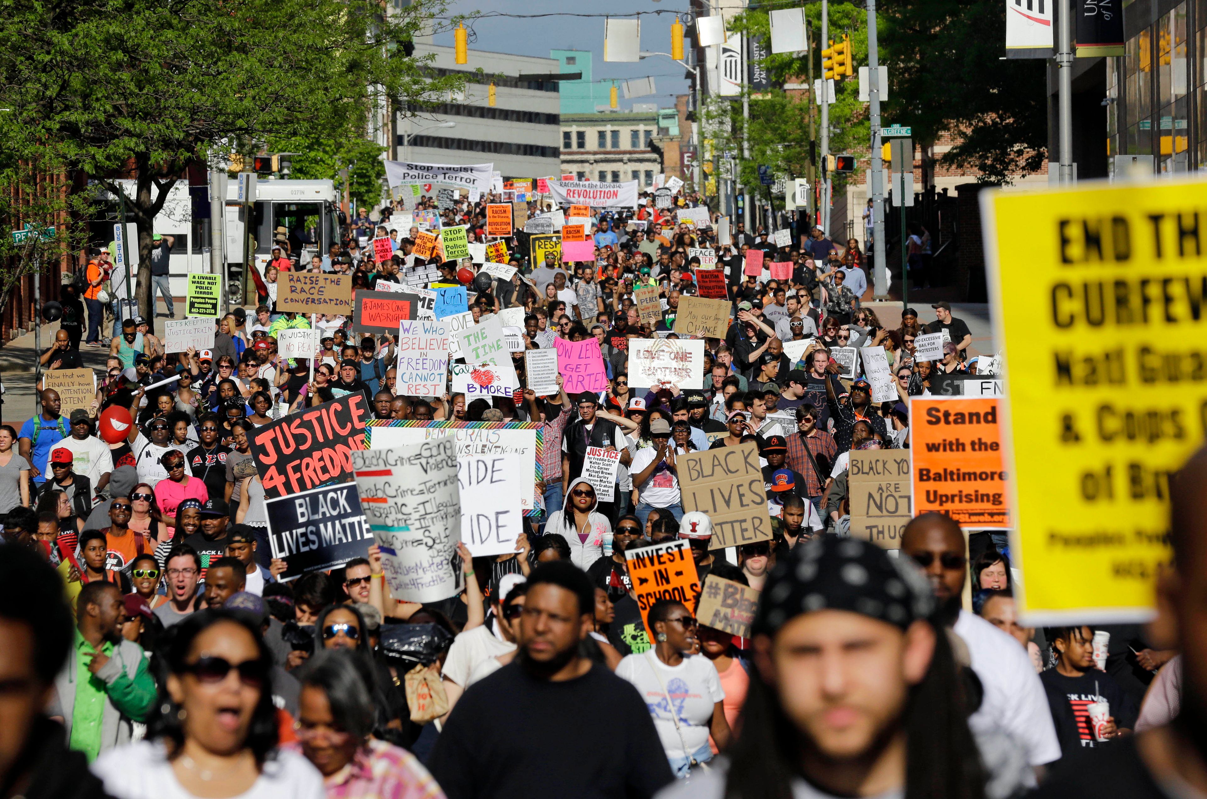 FILE - In this May 2, 2015, file photo, protesters march through Baltimore the day after charges were announced against the police officers involved in Freddie Gray's death. (AP Photo/Patrick Semansky, File)