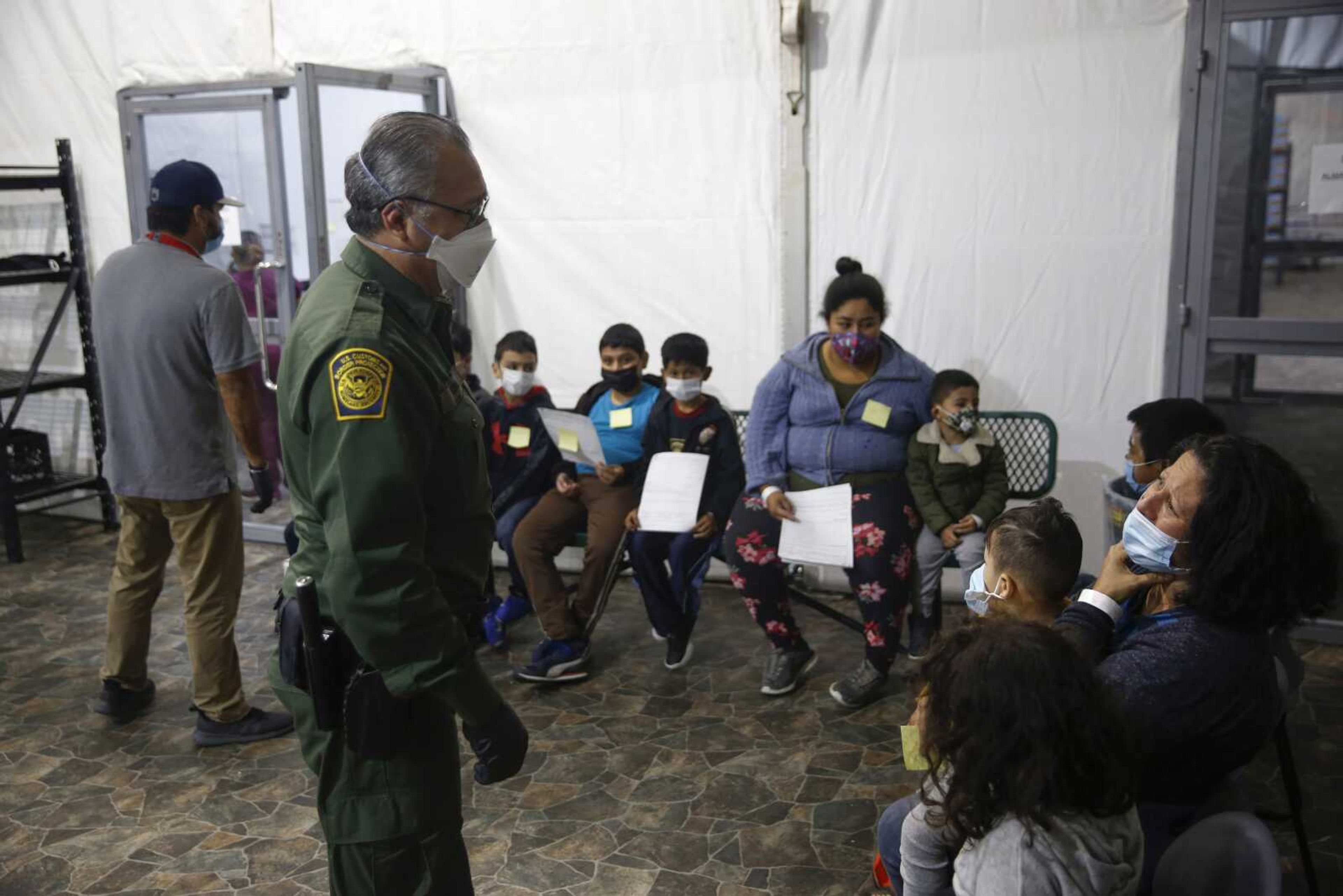 Migrants are processed at the intake area of the U.S. Customs and Border Protection facility, the main detention center for unaccompanied children in the Rio Grande Valley, Tuesday in Donna, Texas.