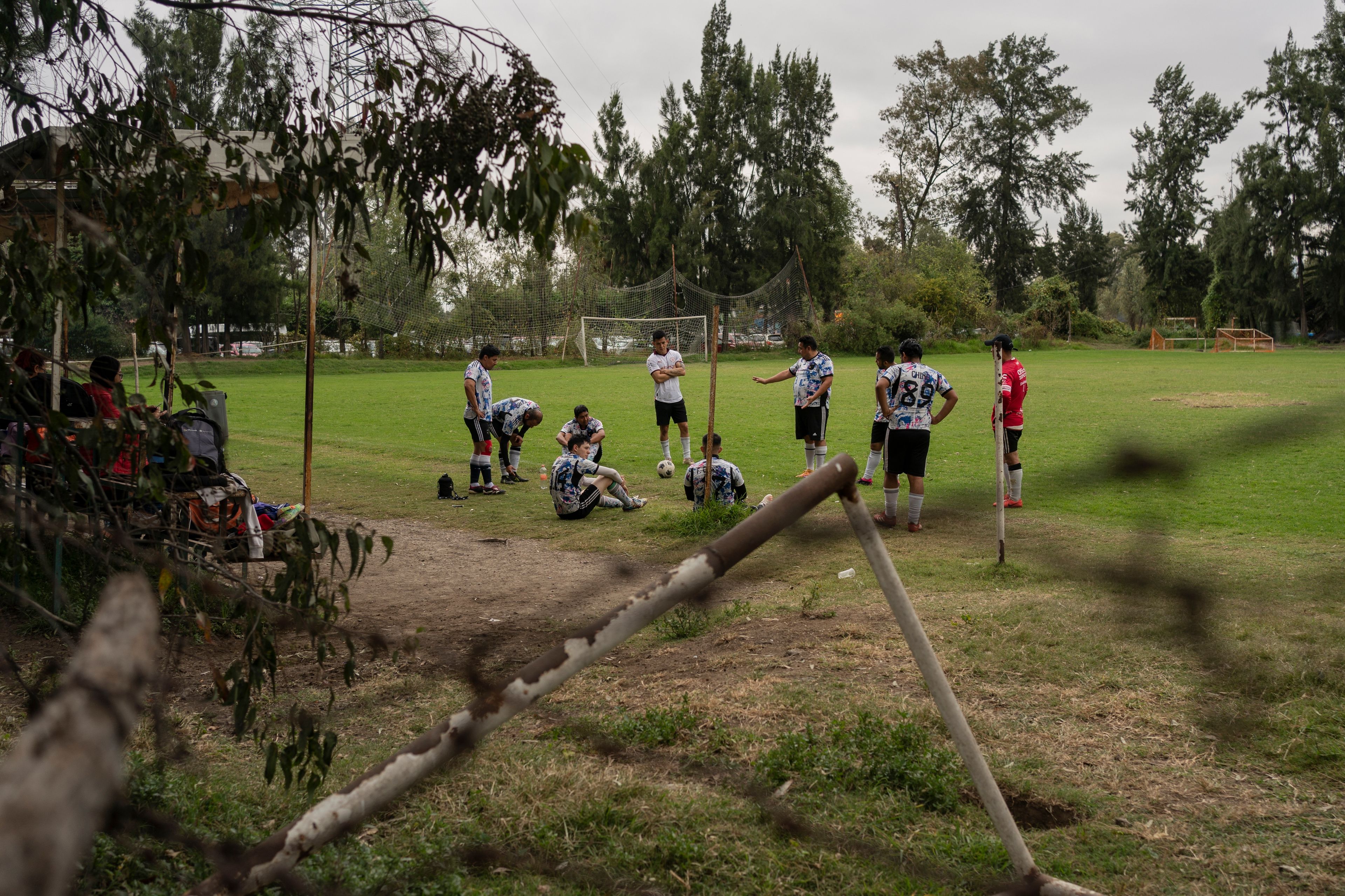 Amateur players take a break on a soccer field in the Xochimilco borough of Mexico City, Sunday, Oct. 20, 2024. (AP Photo/Felix Marquez)