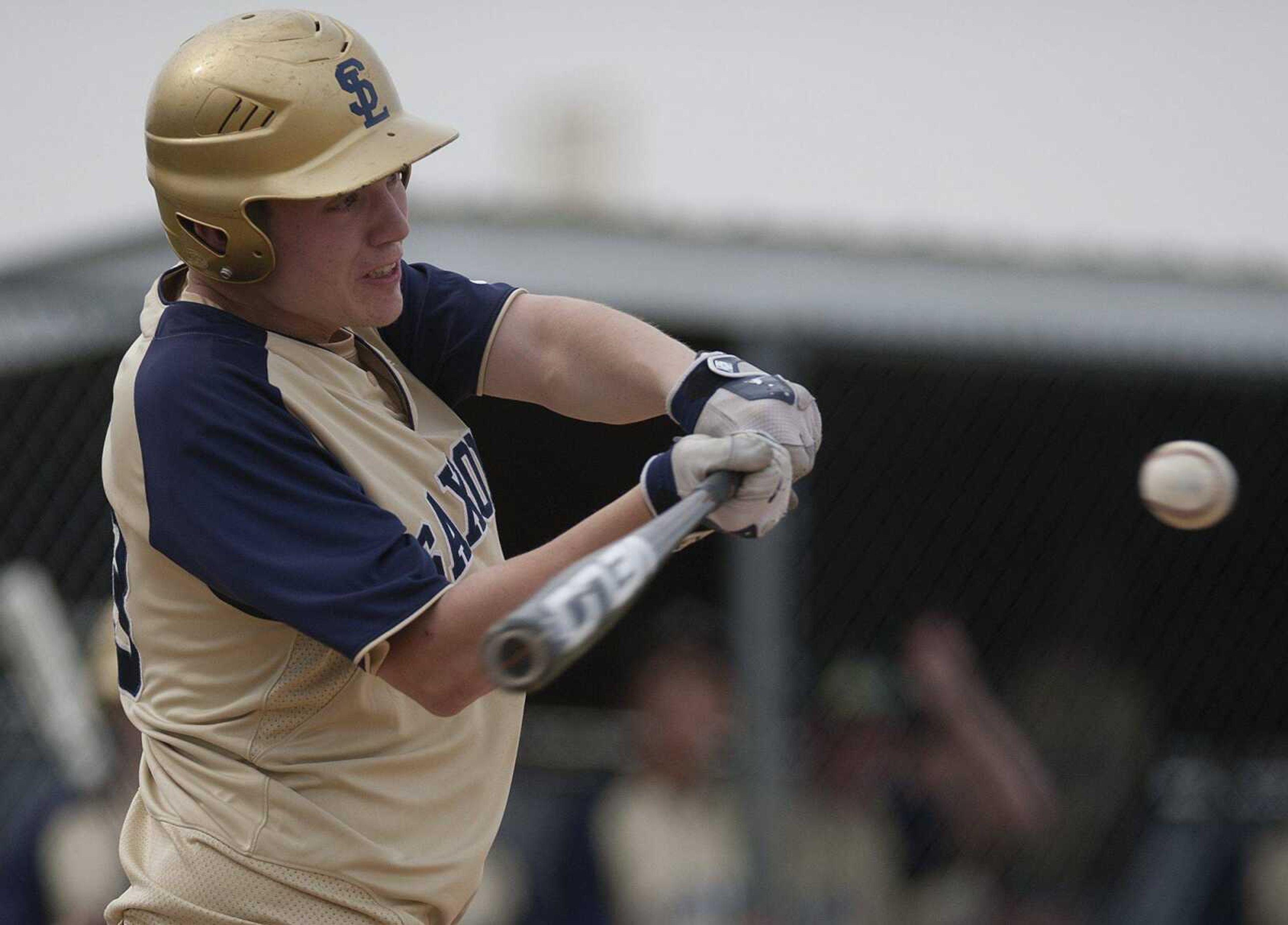 Saxony Lutheran first baseman Jack LakeCQ connects for a sac rice to center driving in Nathan Hurst in the second inning of the Crusaders' 10-6, ten-inning loss to the St. Pius X Lancers Thursday, April 24, at Saxony Lutheran High School. (Adam Vogler)