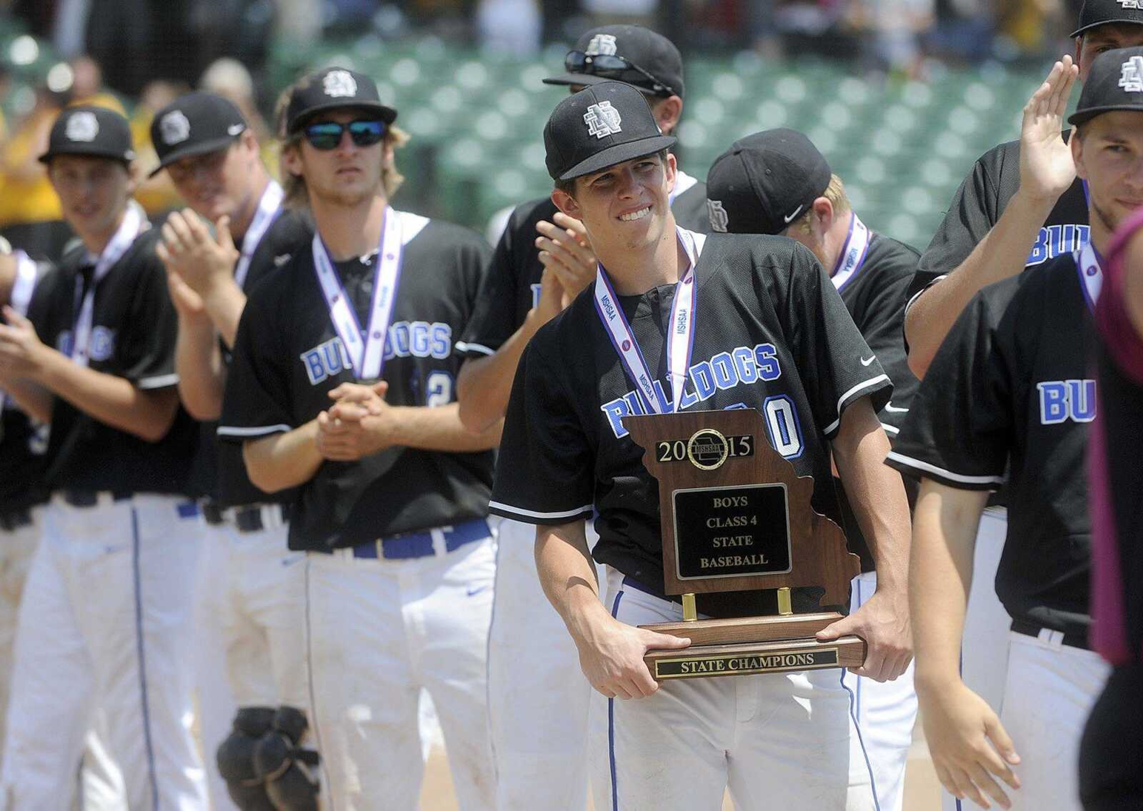 Notre Dame players hold their Class 4 championship trophy after defeating Sullivan 17-0 in five innings, Saturday, June 6, 2015, in O Fallon, Missouri. (Laura Simon)