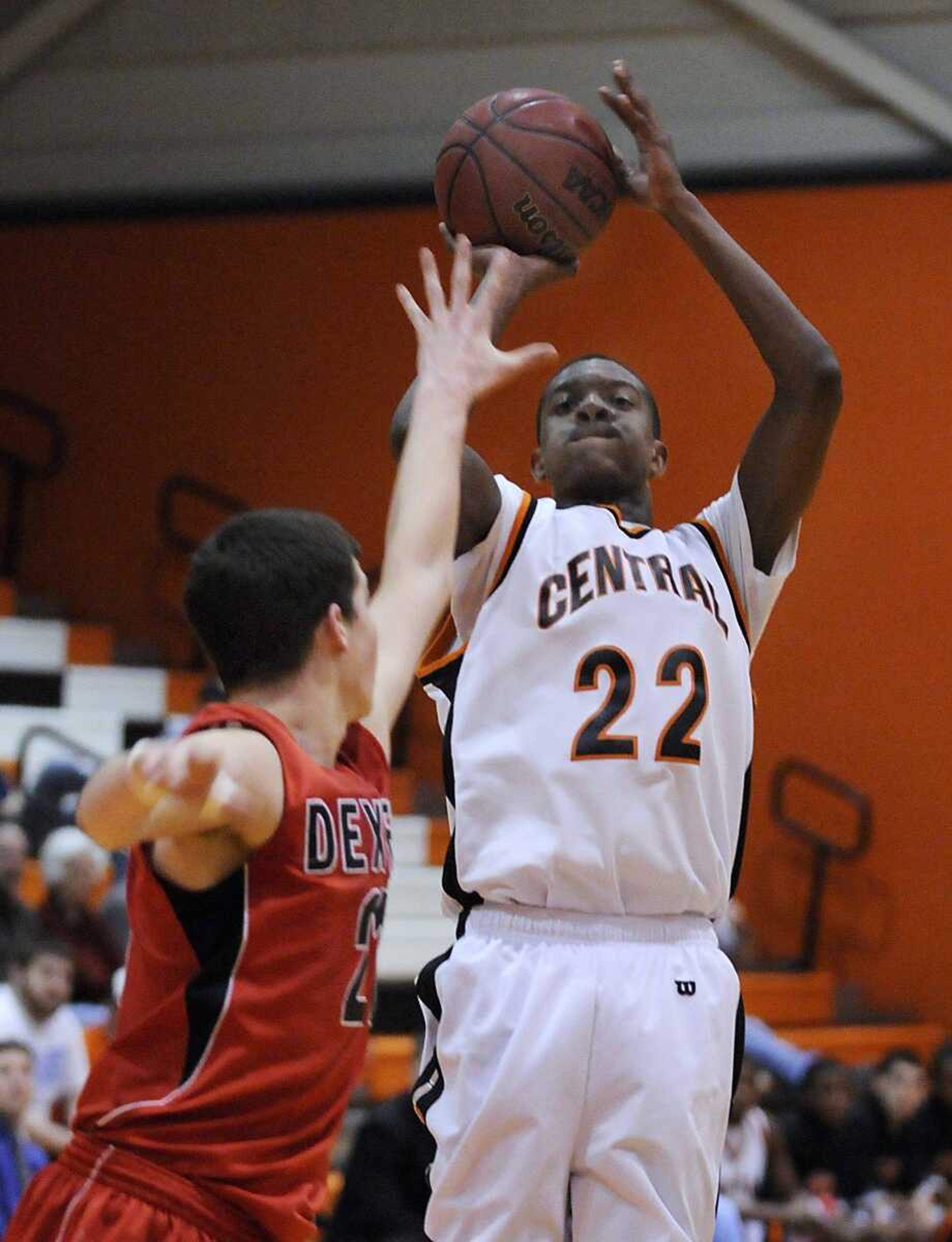 Central's James Lane takes a shot over Dexter's Alan Flannigan during the second quarter Friday. (Kristin Eberts)