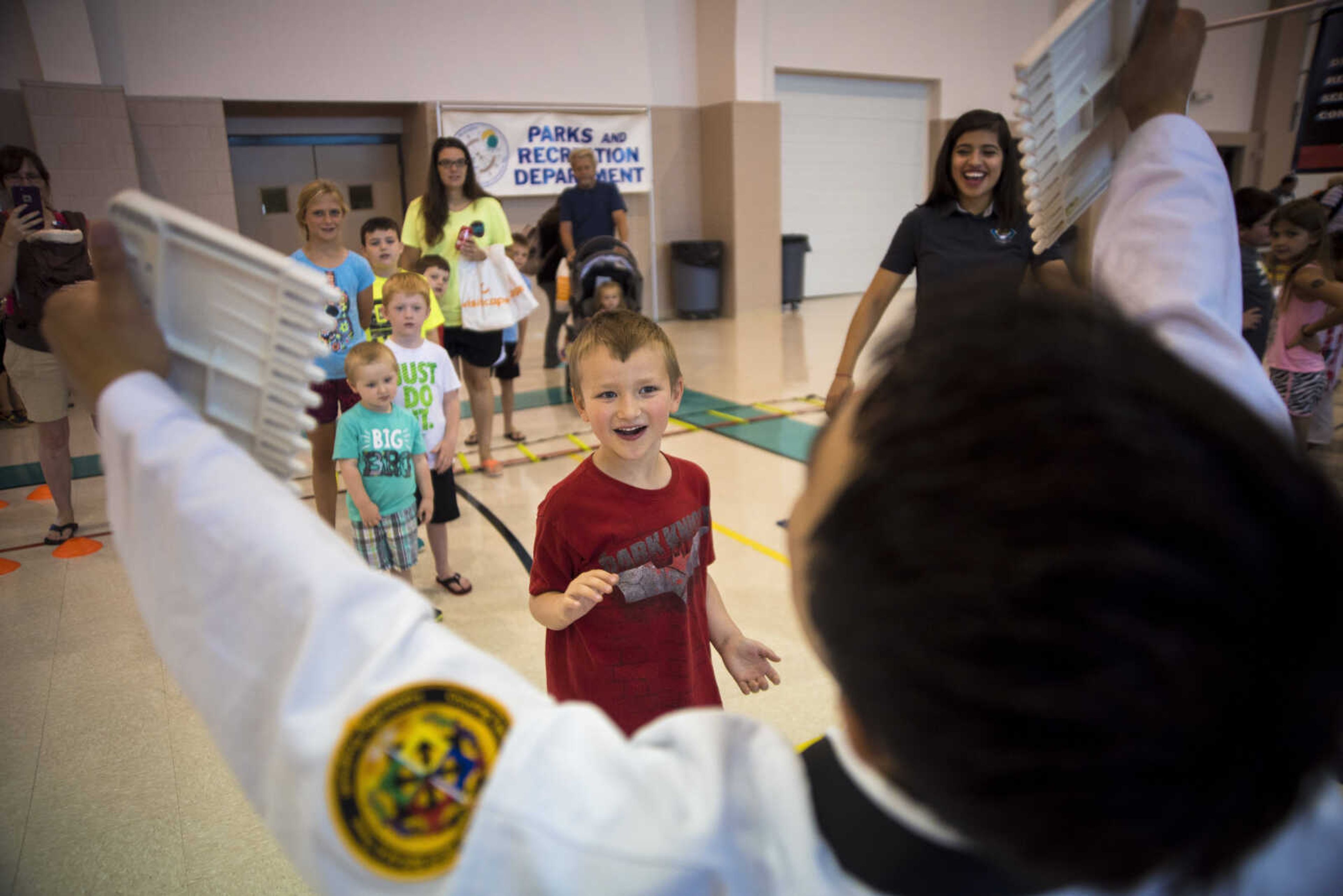 Logan Hanneken, 5, chops a block in half during the Parks and Rec Day Friday, July 7, 2017 at the Osage Centre in Cape Girardeau.