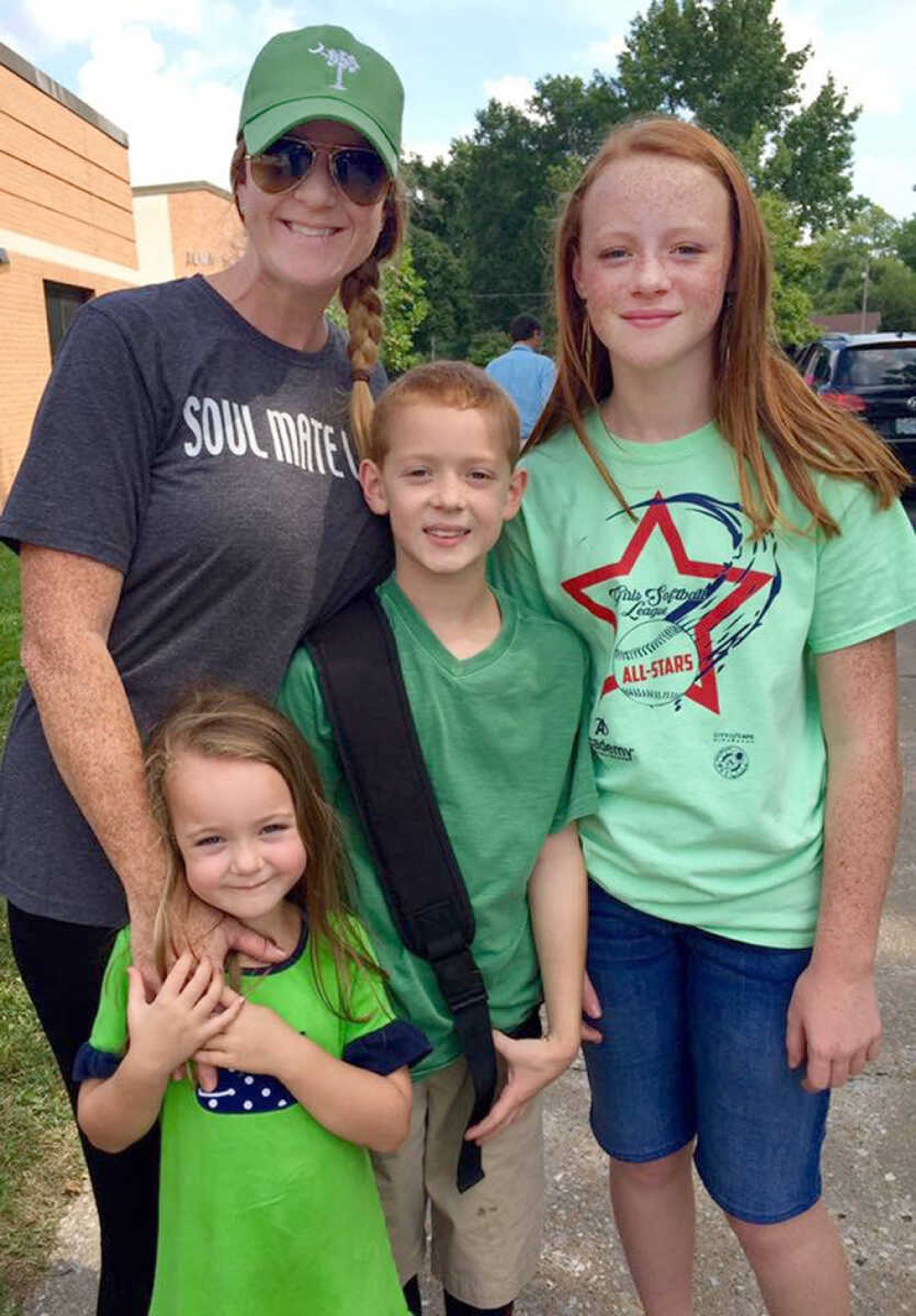 Community members wear green Tuesday, Aug. 18, 2015 to support Lorelai Clubb, a 12-year-old seventh grader who was diagnosed with Acute Myeloid Leukemia in April.