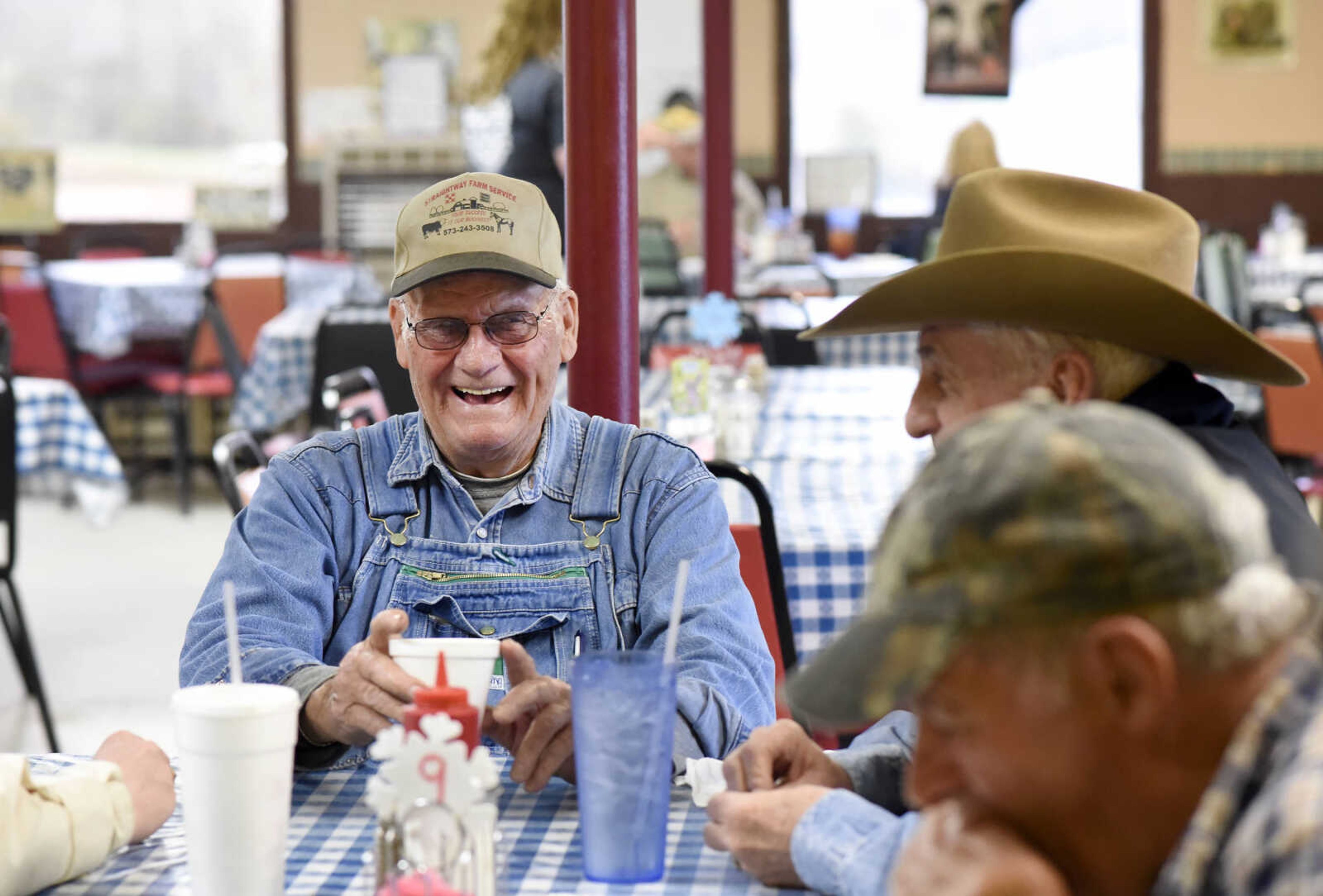 Ronnie Mills visits with customers over lunch on Monday, March 27, 2017, at Bonnie's Moo Cow Cafe in Patton, Missouri.