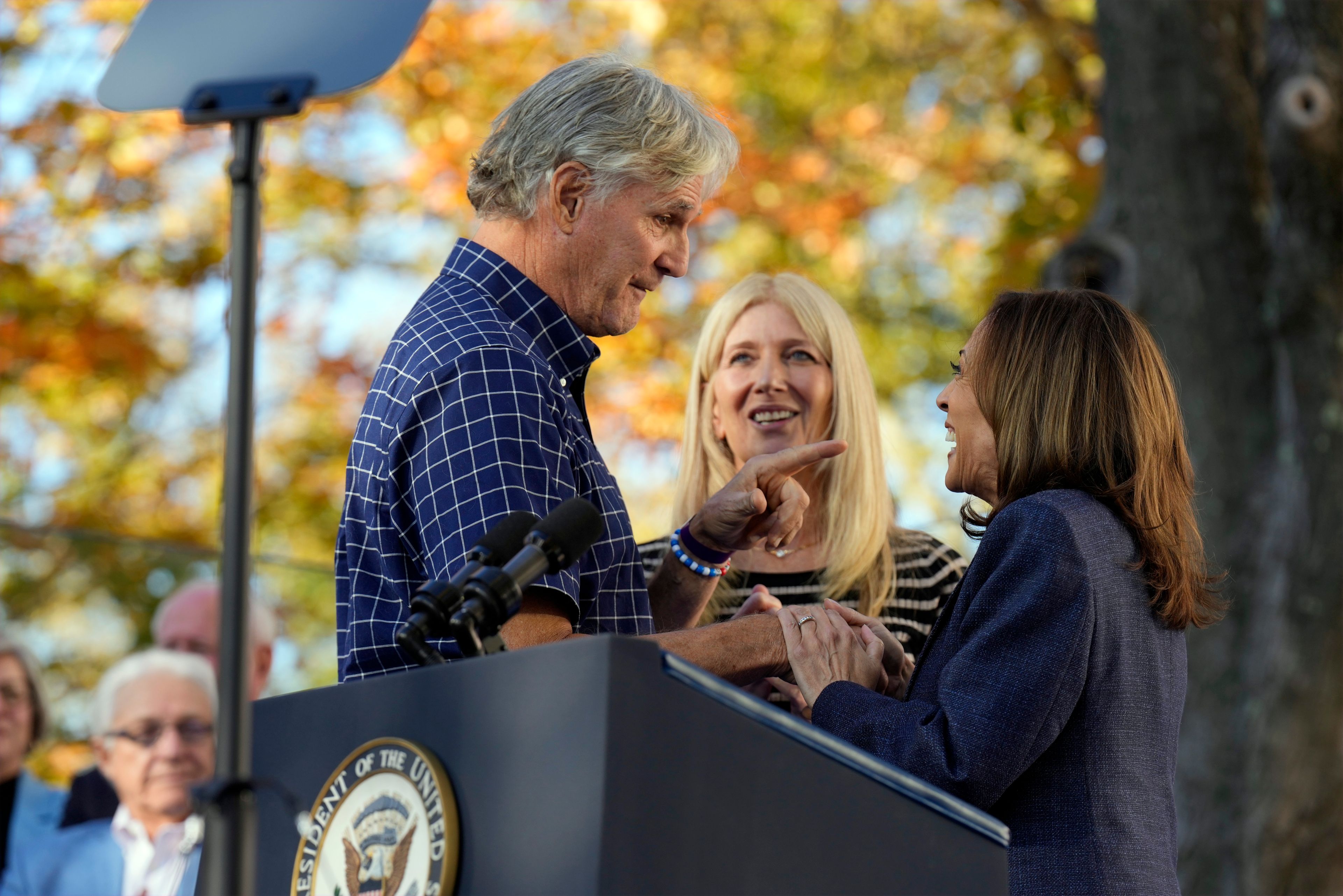 Democratic presidential nominee Vice President Kamala Harris talks with Bob and Christina Lang before speaking during a campaign event at Washington Crossing Historic Park, Wednesday, Oct. 16, 2024, in Washington Crossing, Pa. (AP Photo/Jacquelyn Martin)