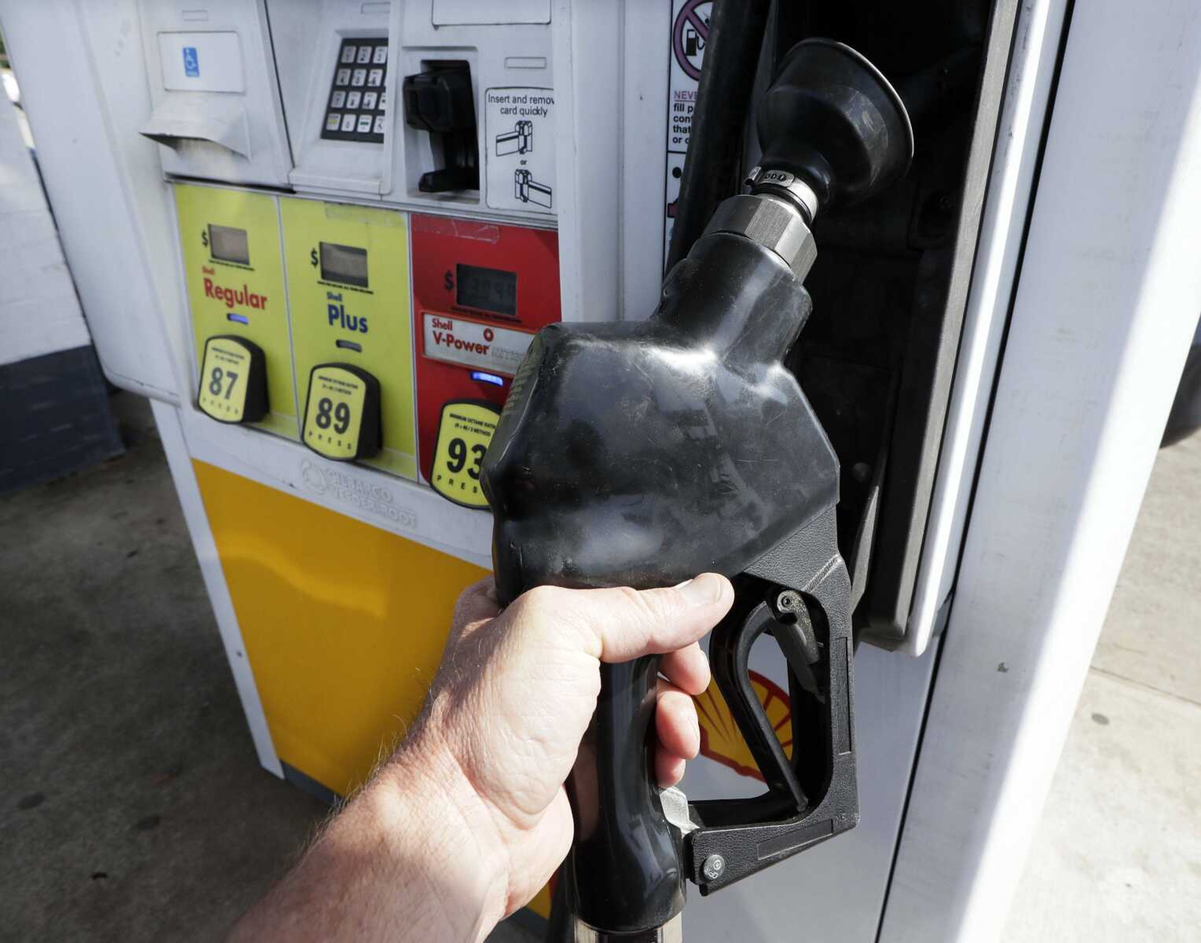 Gas is pumped at a filling station in Nashville, Tennessee. By air or car, summer 2017 travel numbers are expected to rise over the previous year, thanks to deals on airfares and stable gasoline prices.