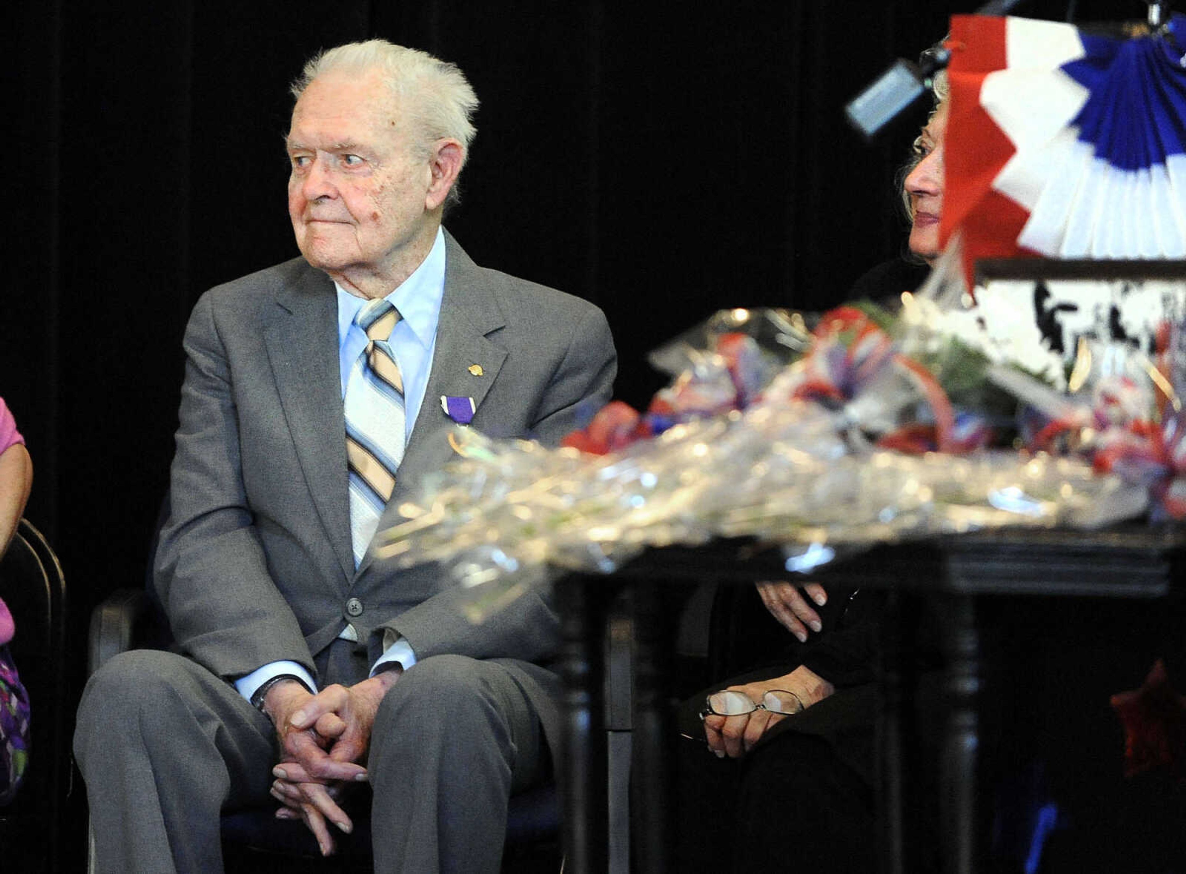 LAURA SIMON ~ lsimon@semissourian.com

U.S. Army Air Corps veteran Sgt. Clifford Heinrich looks out at the crowd on Monday, March 21, 2016, during the living history event honoring the WWII lost crew of the Flying Fortress 812, and the medal presentation to Sgt. Clifford Heinrich at Alma Schrader Elementary.