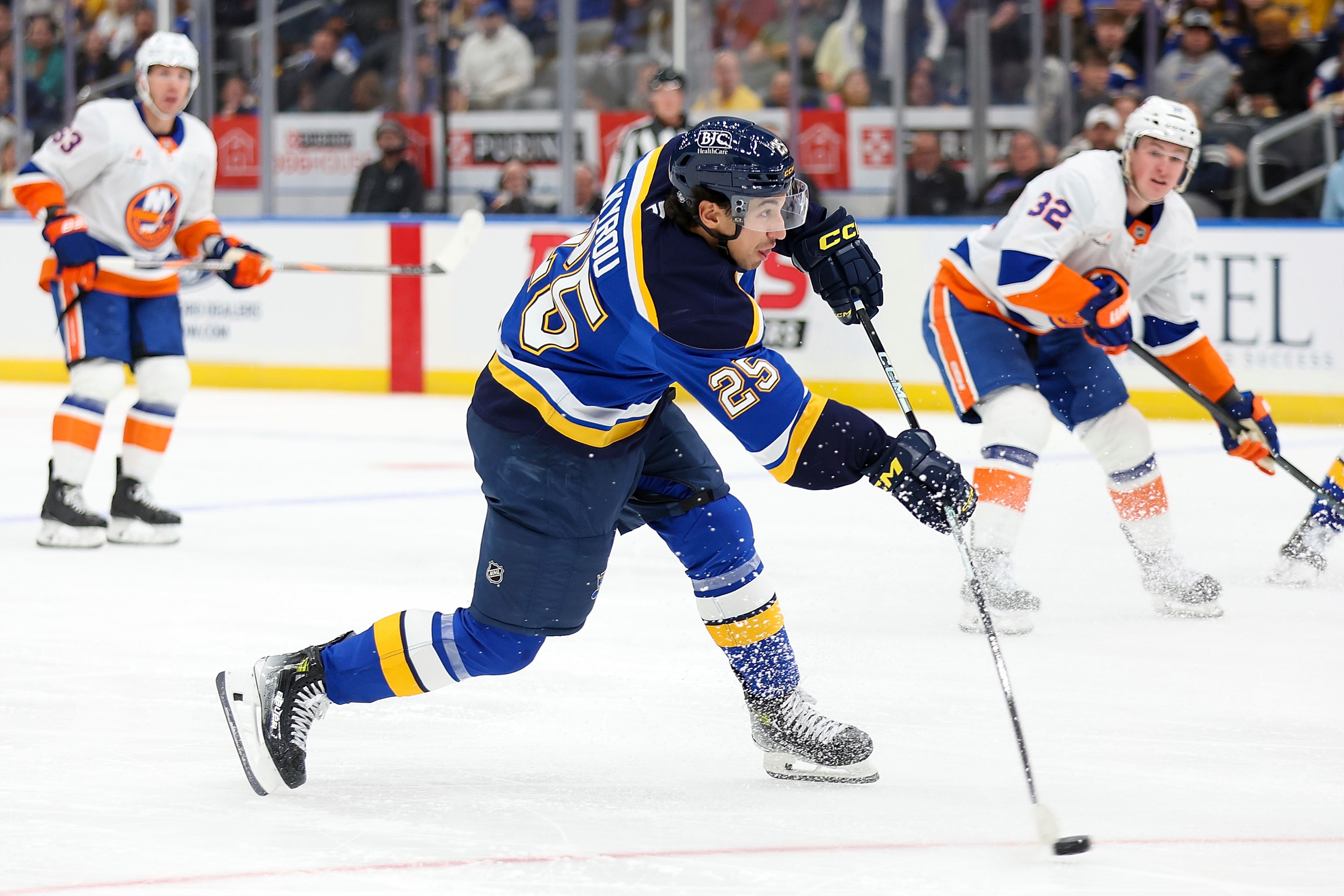 St. Louis Blues' Jordan Kyrou (25) shoots on goal during the second period of an NHL hockey game against the New York Islanders Thursday, Oct. 17, 2024, in St. Louis. (AP Photo/Scott Kane)