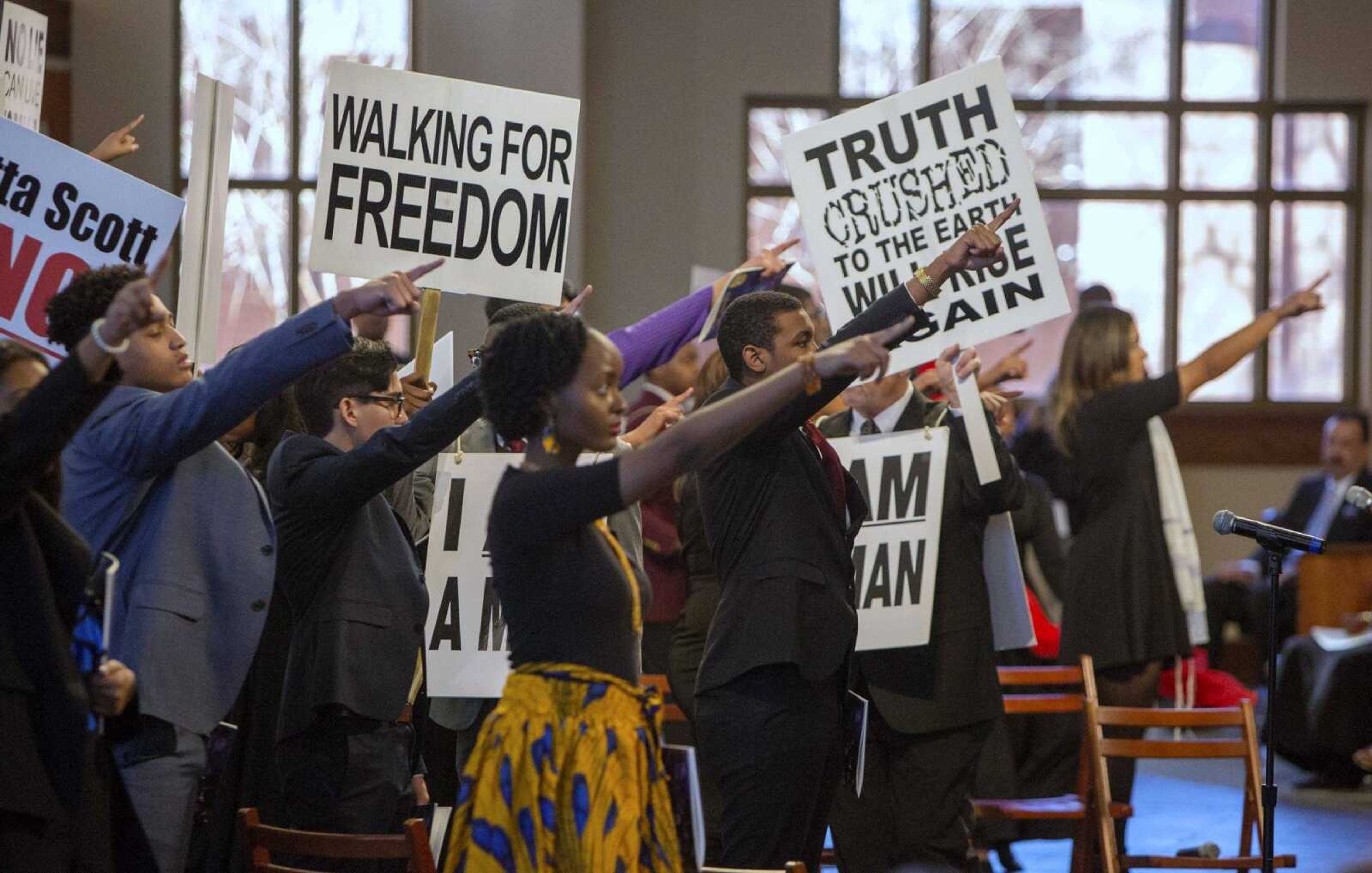 Actors reenact a tribute to the Rev. Martin Luther King Jr. during the annual service at Ebenezer Baptist Church in Atlanta on Monday.