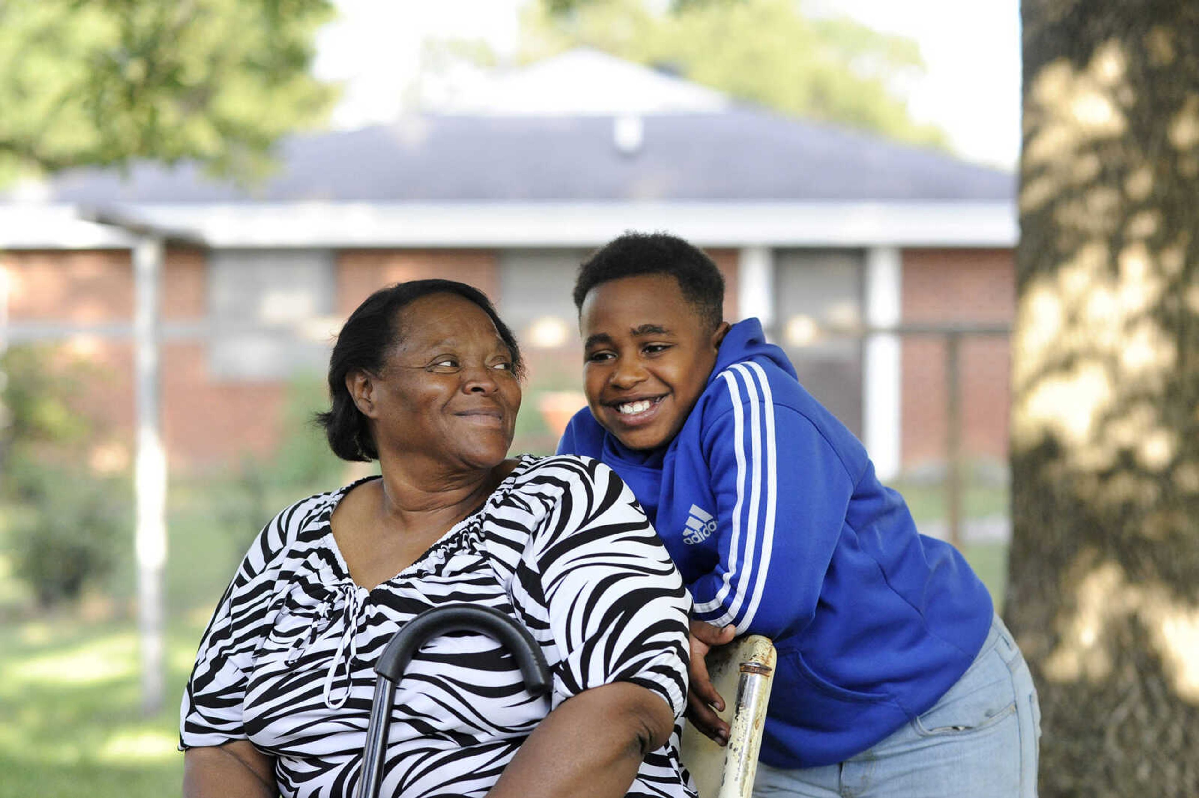 LAURA SIMON ~ lsimon@semissourian.com

Jennett McCaster, and David Robinson's nephew, Maliek Patterson, visit outside McCaster's Sikeston, Missouri home in September.