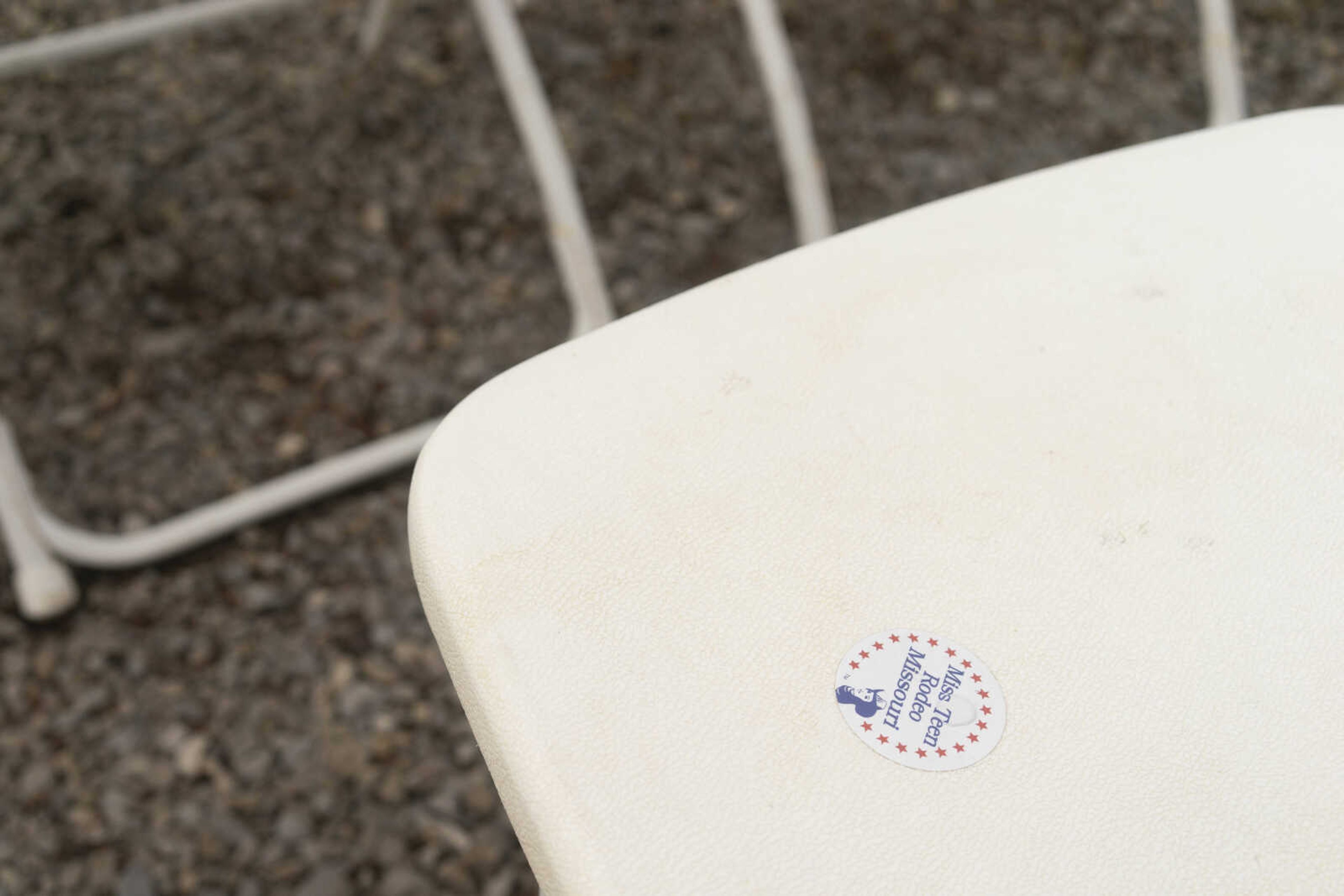 A discarded Miss Teen Rodeo Missouri sticker is seen in the stands during the third night of the Sikeston Jaycee Bootheel Rodeo Friday, Aug. 13, 2021,&nbsp;&nbsp;in Sikeston, Missouri.