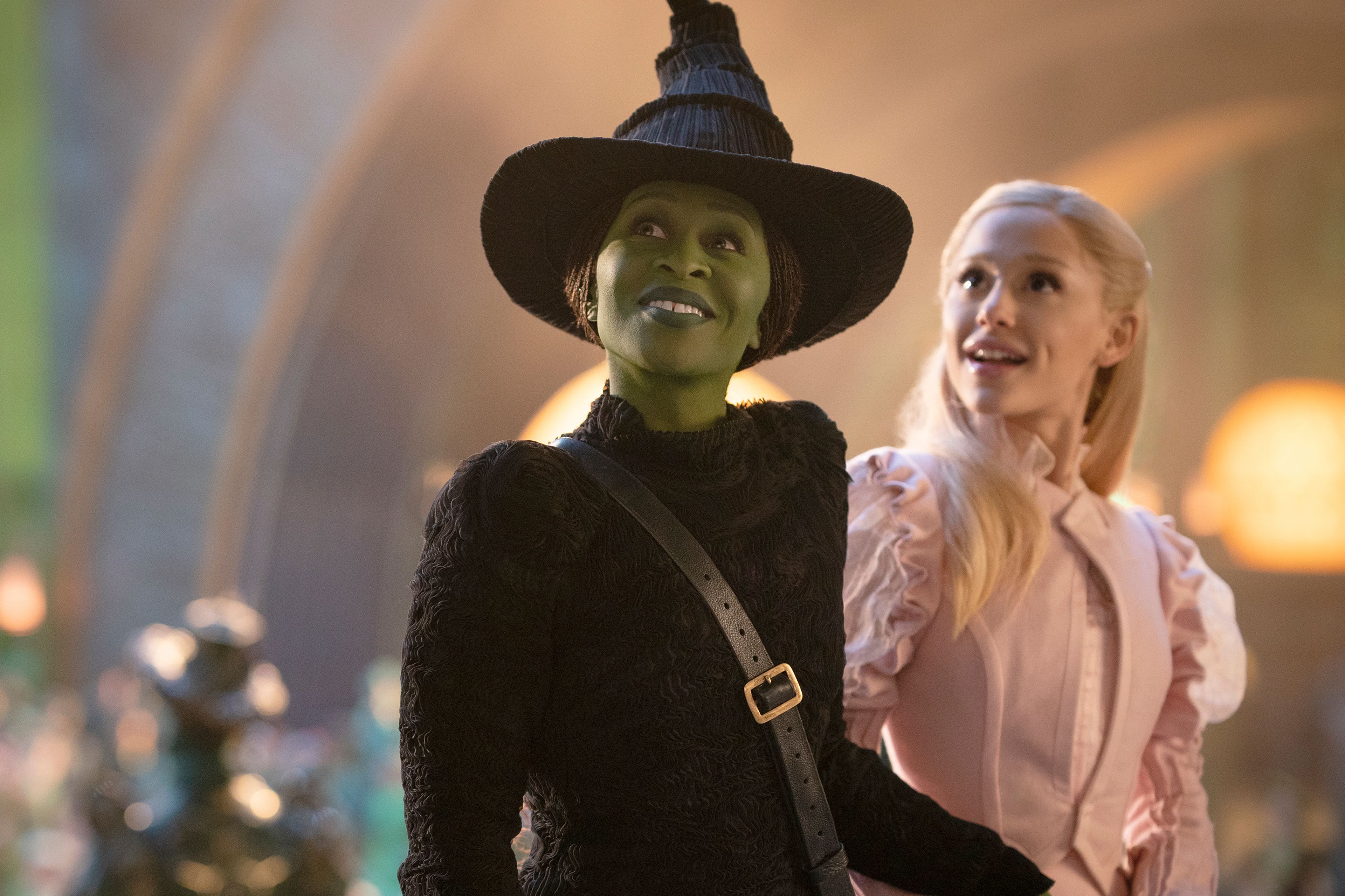 This image released by Universal Pictures shows Cynthia Erivo, left, and Ariana Grande in a scene from the film "Wicked." (Giles Keyte/Universal Pictures via AP)