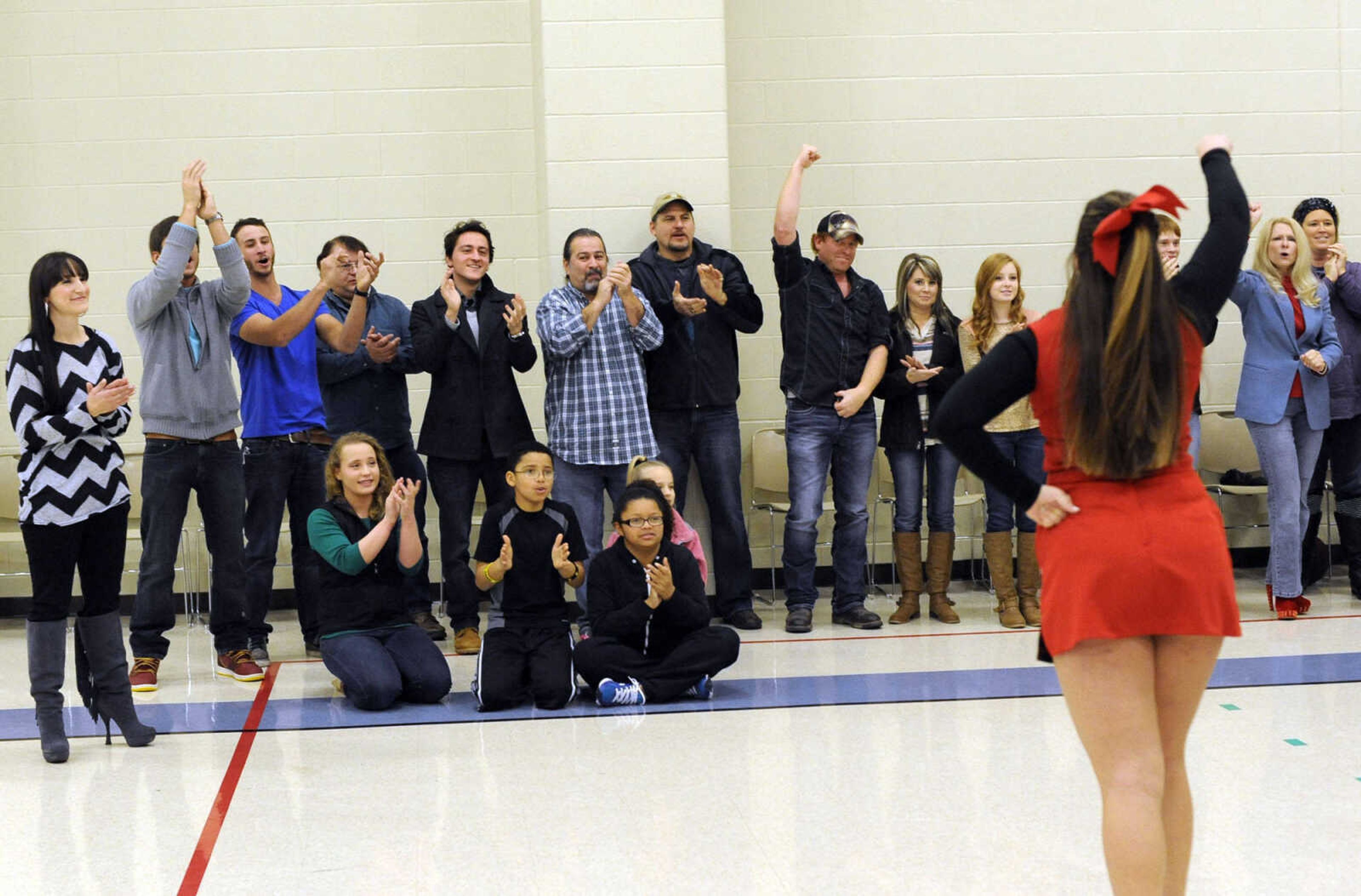 Some of the extras cheer during filming of the movie, "Love Chronicles (of the Cape)" on Sunday, Jan. 11, 2015 at Shawnee Park Center in Cape Girardeau.