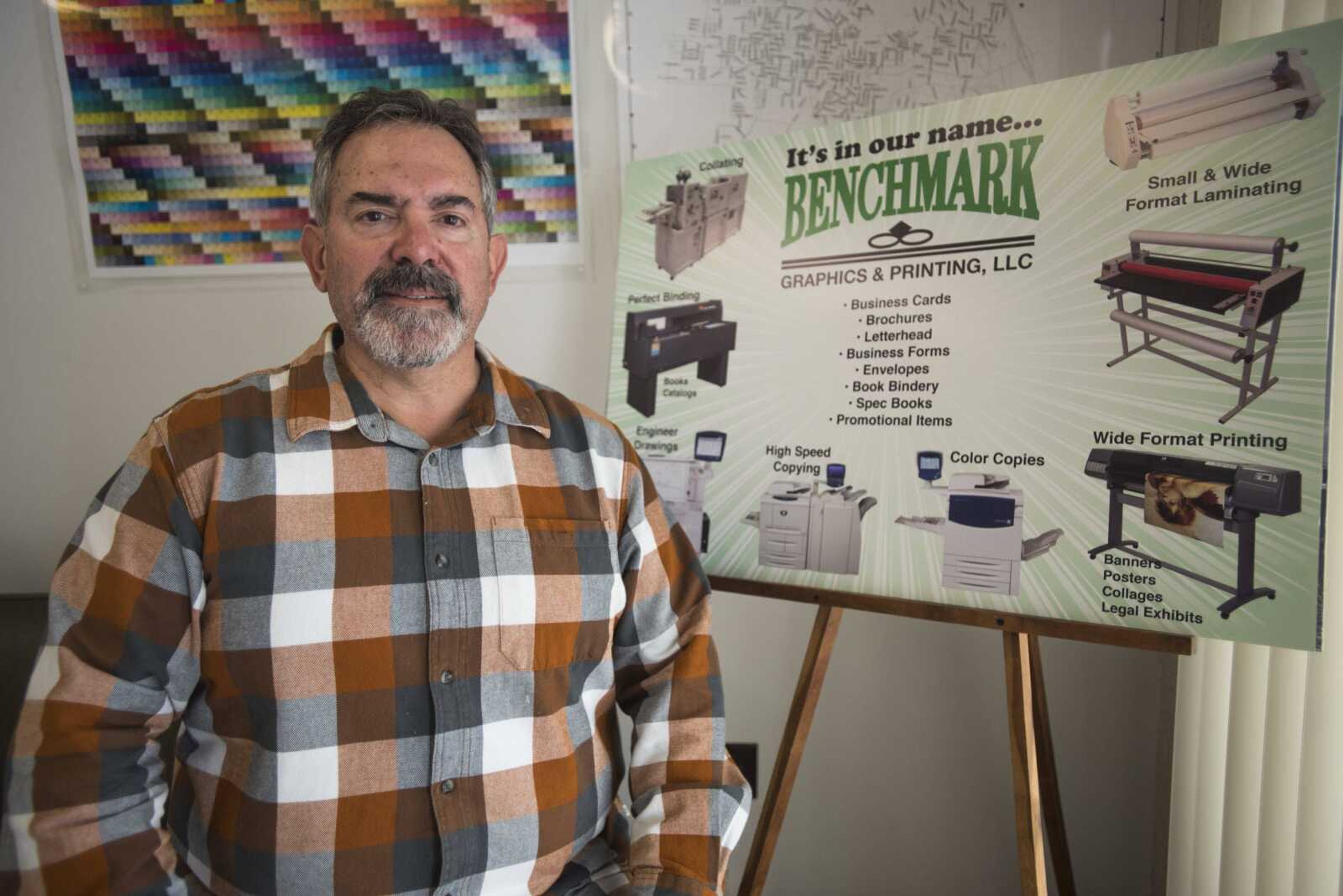 Steve Skelton poses for a photo in the lobby of Benchmark Graphics & Printing on Friday in Jackson.