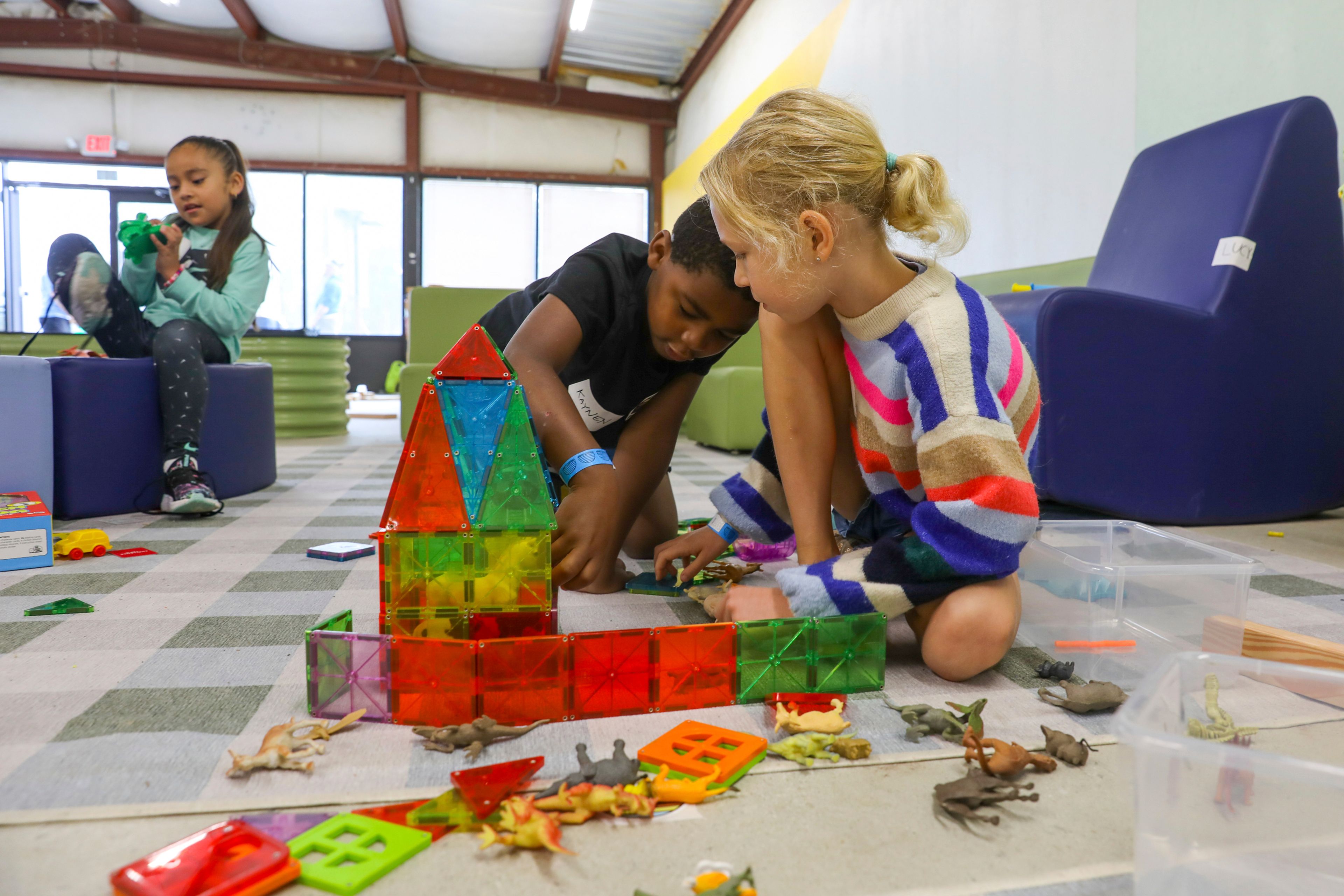 Children play games at the Project:Camp pop-up daycamp for families impacted by Hurricane Helene at the Boys and Girls Club of Transylvania County in Brevard, N.C., Monday, Oct. 7, 2024. (AP Photo/Gabriela Aoun Angueira)