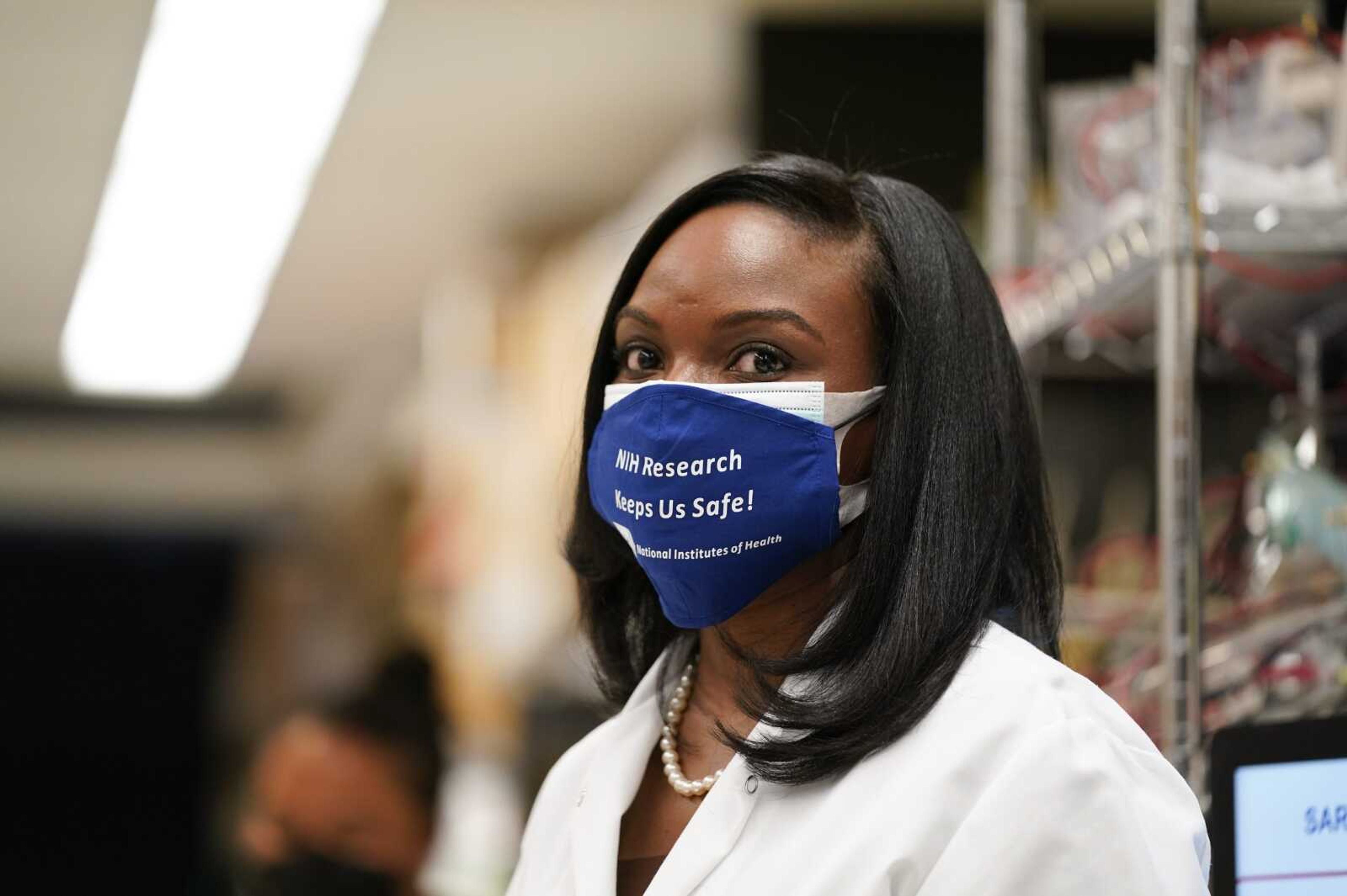 Kizzmekia Corbett, an immunologist with the Vaccine Research Center at the National Institutes of Health looks on at the Viral Pathogenesis Laboratory on Feb. 11 at the NIH in Bethesda, Maryland.