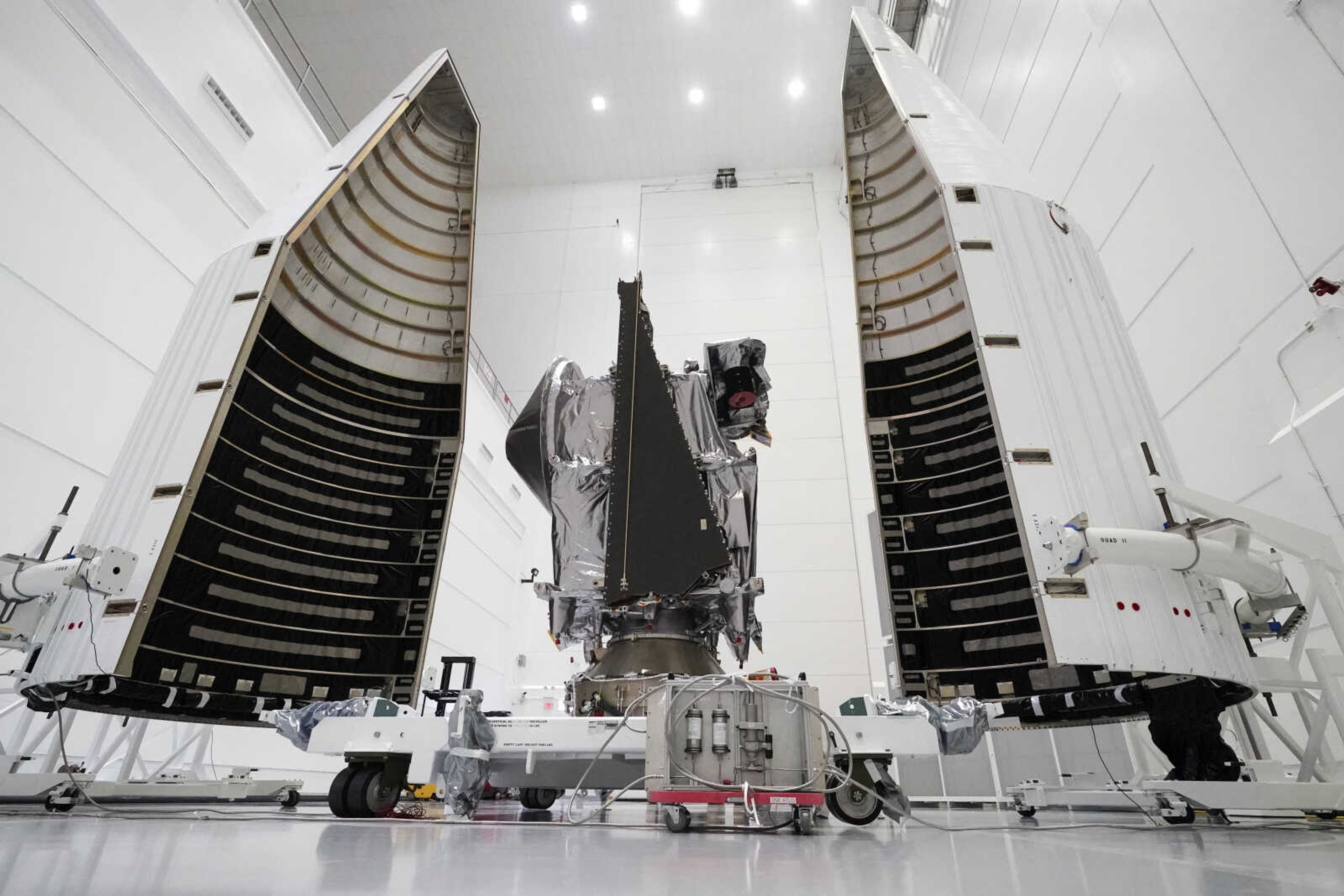 NASA’s Lucy spacecraft with its housing is seen Sept. 29 at the AstroTech facility in Titusville, Florida.