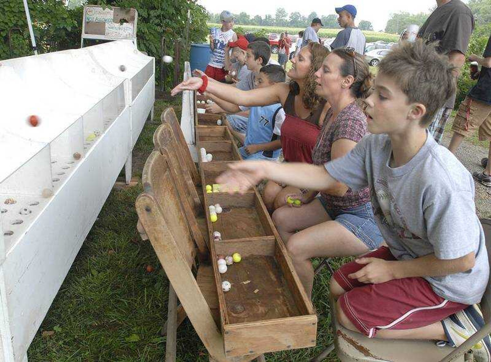 FRED LYNCH ~ flynch@semissourian.com
A bingo-styled game, "I Got It," was a hit Friday at the Knights of Columbus Fourth of July Picnic in Oran, Mo. From right were Garret Menz of Chaffee, Lisa Moit of Benton and her niece, Faye Schaefer of Austin, Tex.