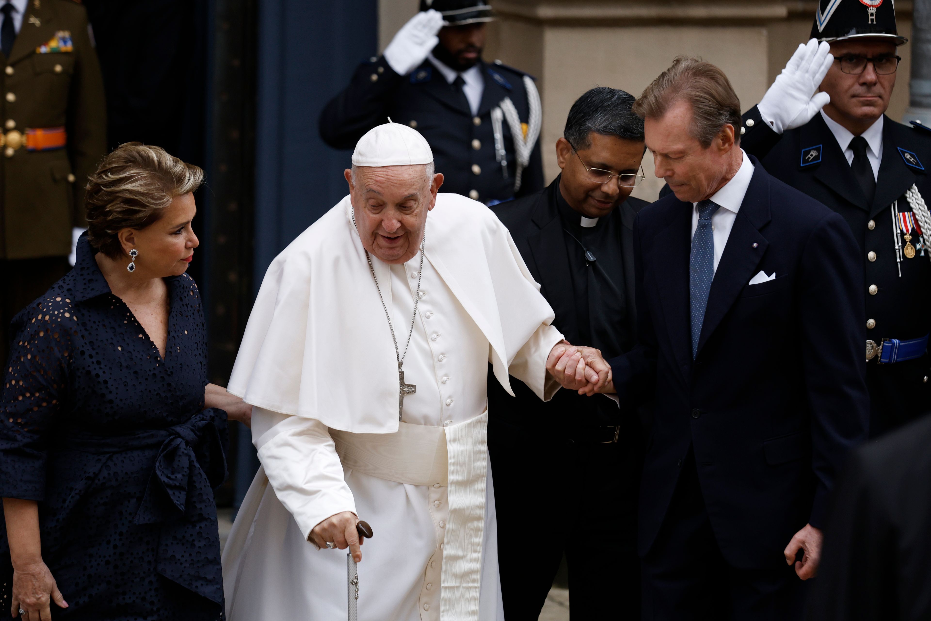 Pope Francis is welcomed by Grand Duchess Maria Teresa, left, and Luxembourg's Grand Duke Henri, right, at the Grand Ducal Palace in Luxembourg, Thursday, Sept. 26, 2024. (AP Photo/Omar Havana)