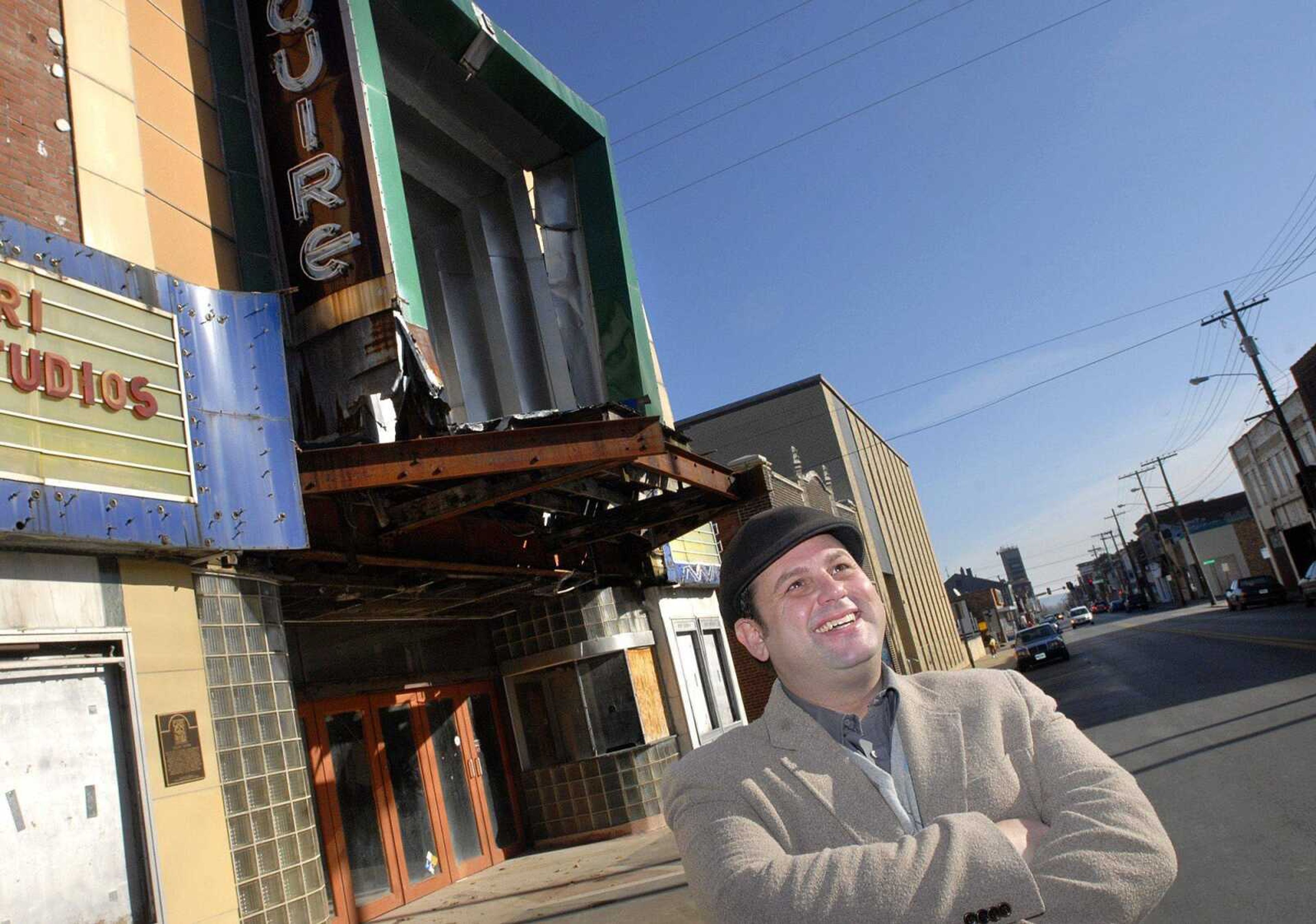 John Buckner, owner of the newly formed Broadway Esquire Entertainment Group, stands along Broadway in Cape Girardeau Wednesday morning, Dec. 28, 2011. Buckner is purchasing the Esquire Theater and hopes to purchase three more building on Broadway, one of which will be a 24-hour diner. (Laura Simon)