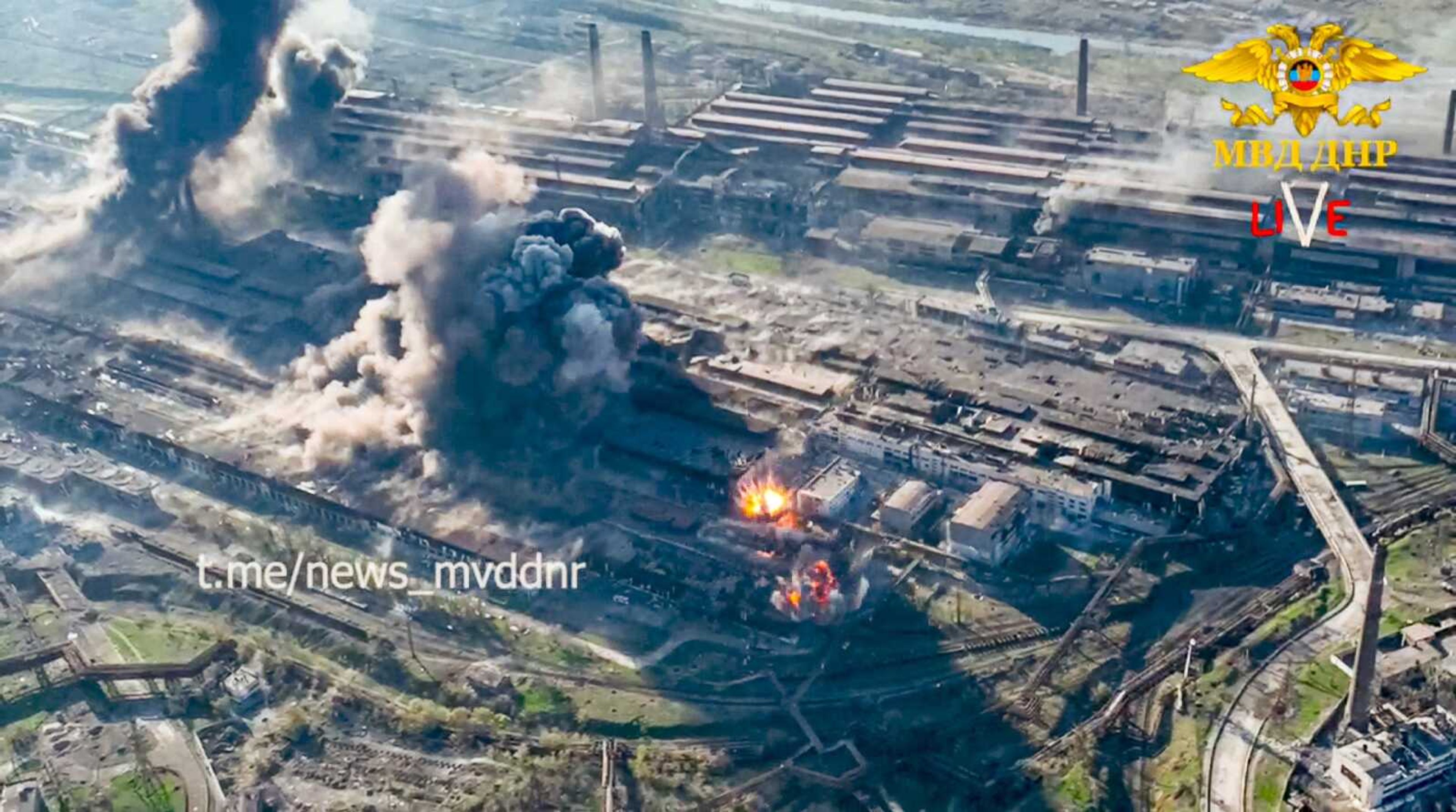 In this handout photo taken from video released Wednesday, smoke rises from the Metallurgical Combine Azovstal in Mariupol, in territory under the government of the Donetsk People's Republic, eastern Ukraine. Heavy fighting is raging at the besieged steel plant in Mariupol as Russian forces attempt to finish off the city's last-ditch defenders and complete the capture of the strategically vital port.