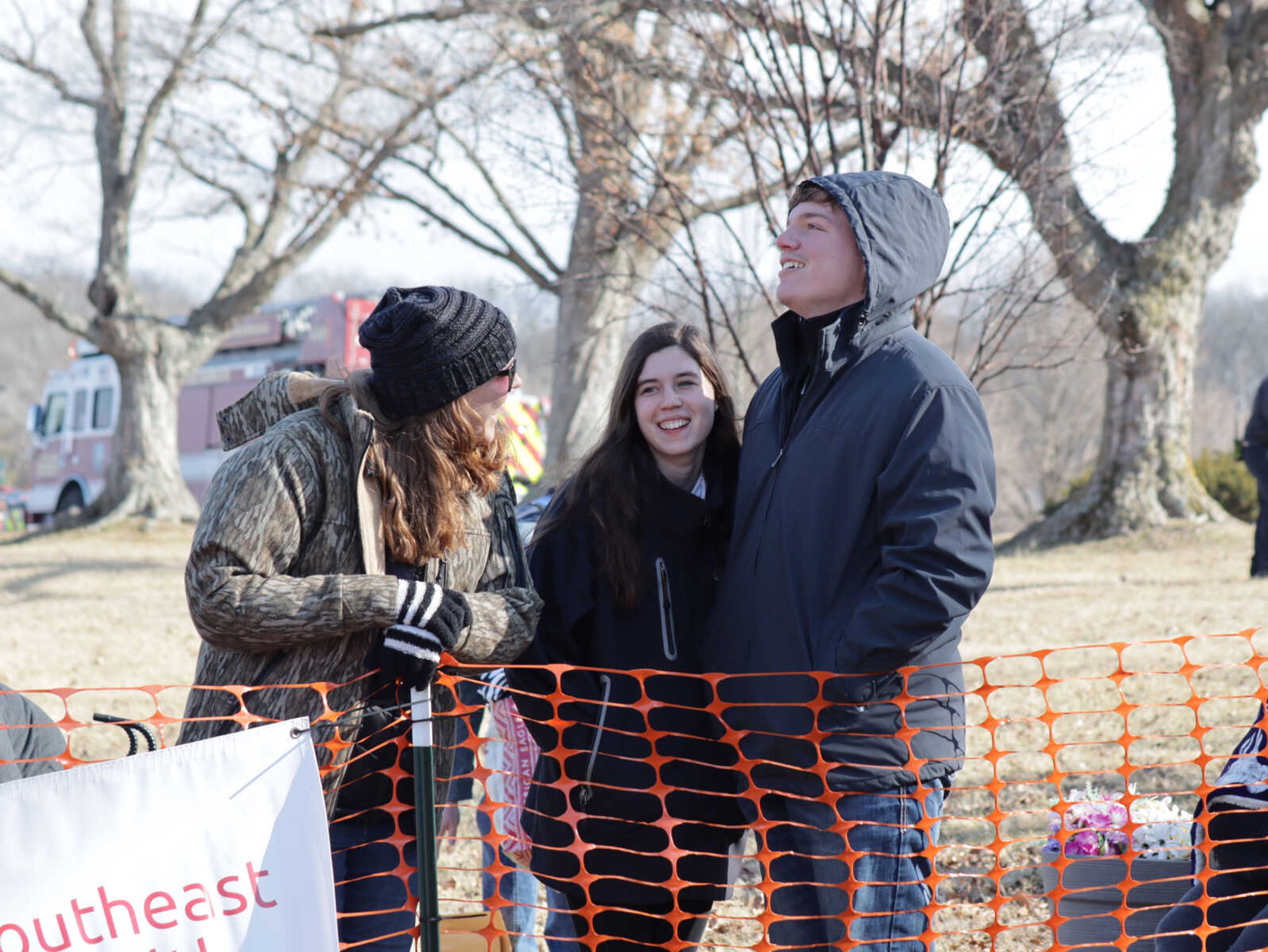 Audience members watching on as plungers run past.