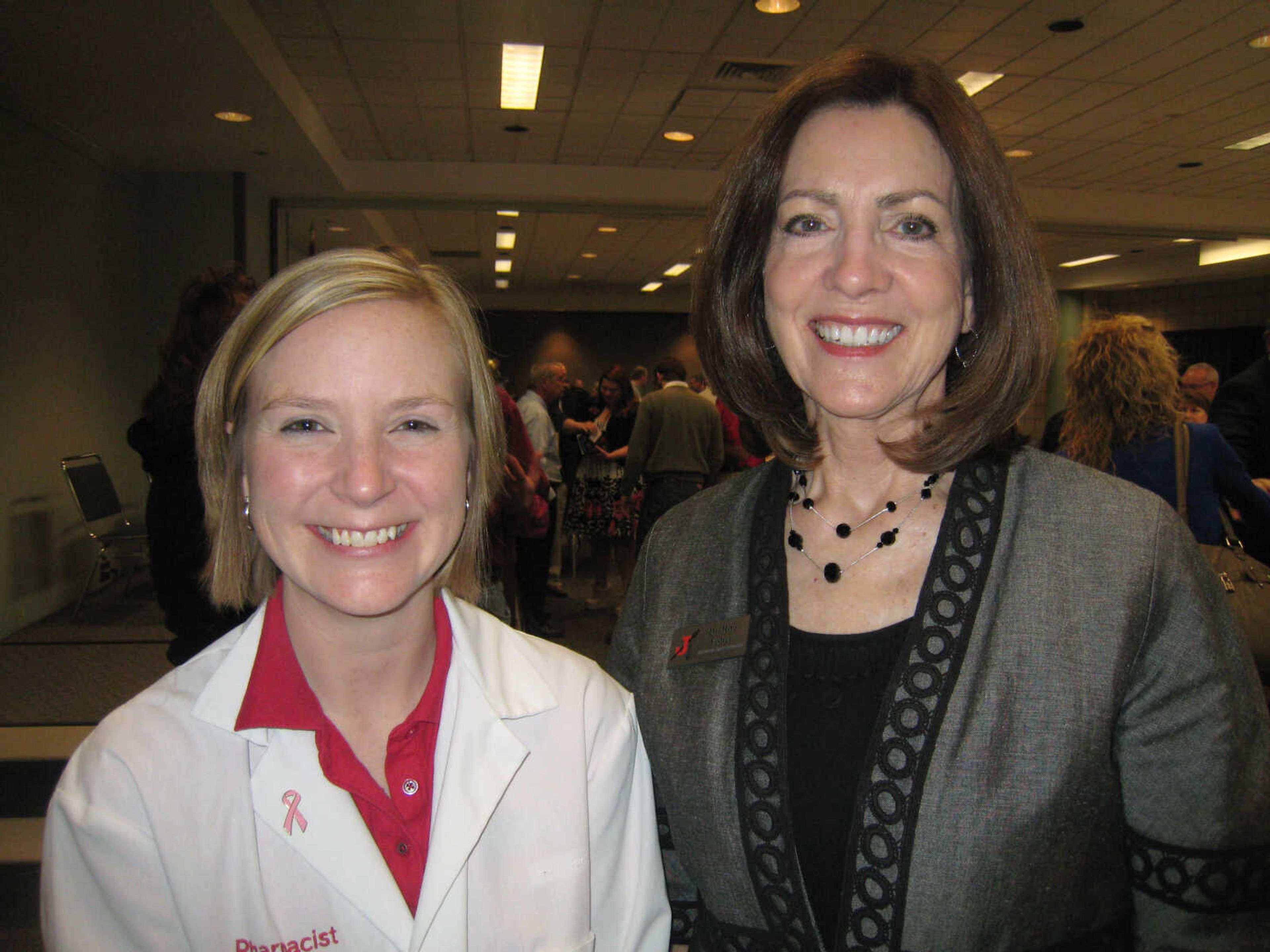 Jennifer McCoy, left, MediCenter Pharmacy; and Dr. Rita Fisher, Jackson School District, pose at the Cape Girardeau Area Chamber of Commerce First Friday Coffee, April 5 at the Show Me Center.