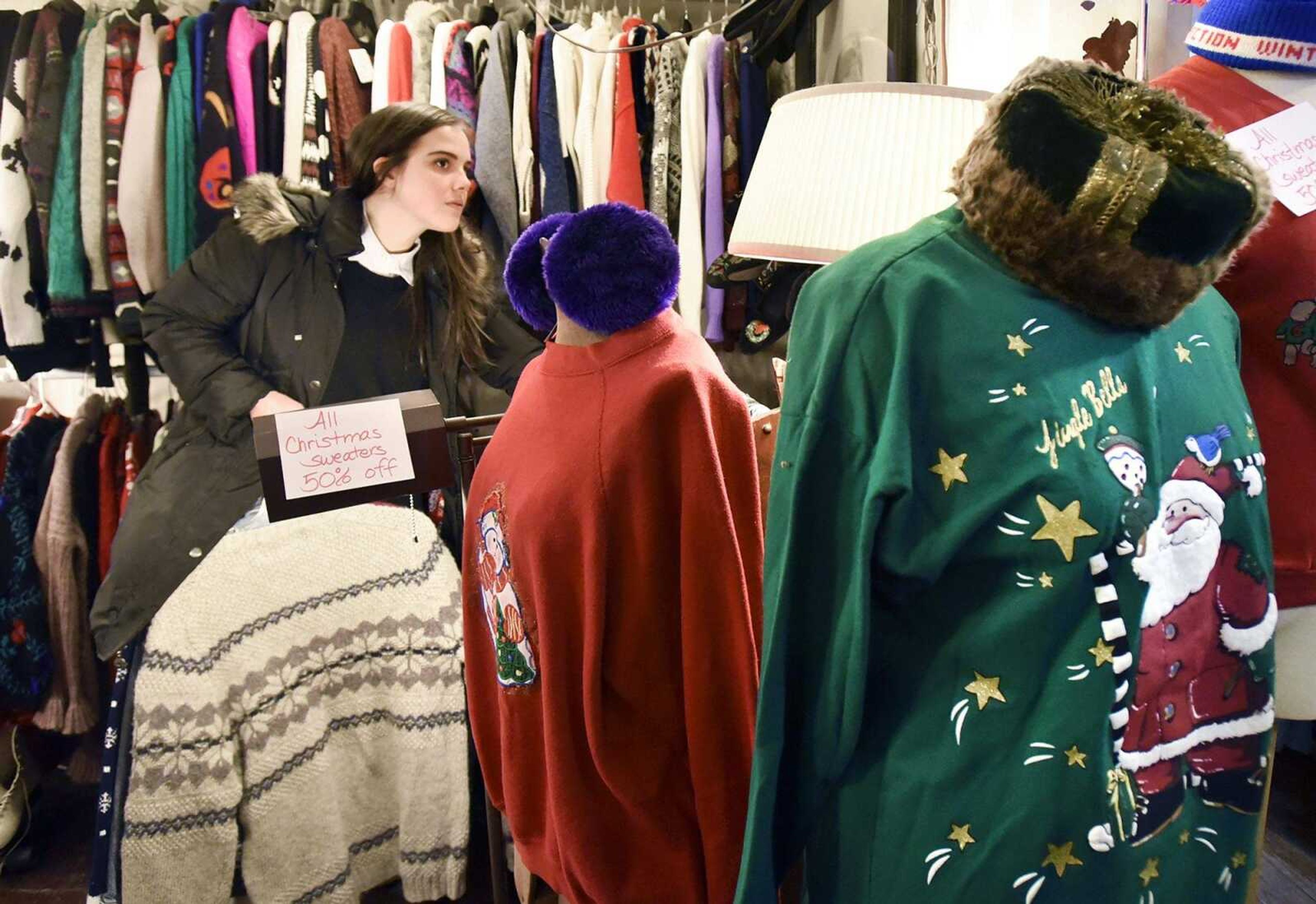 Michelle Spencer shops for a holiday sweater at Annie Laurie's in Cape Girardeau on Monday.