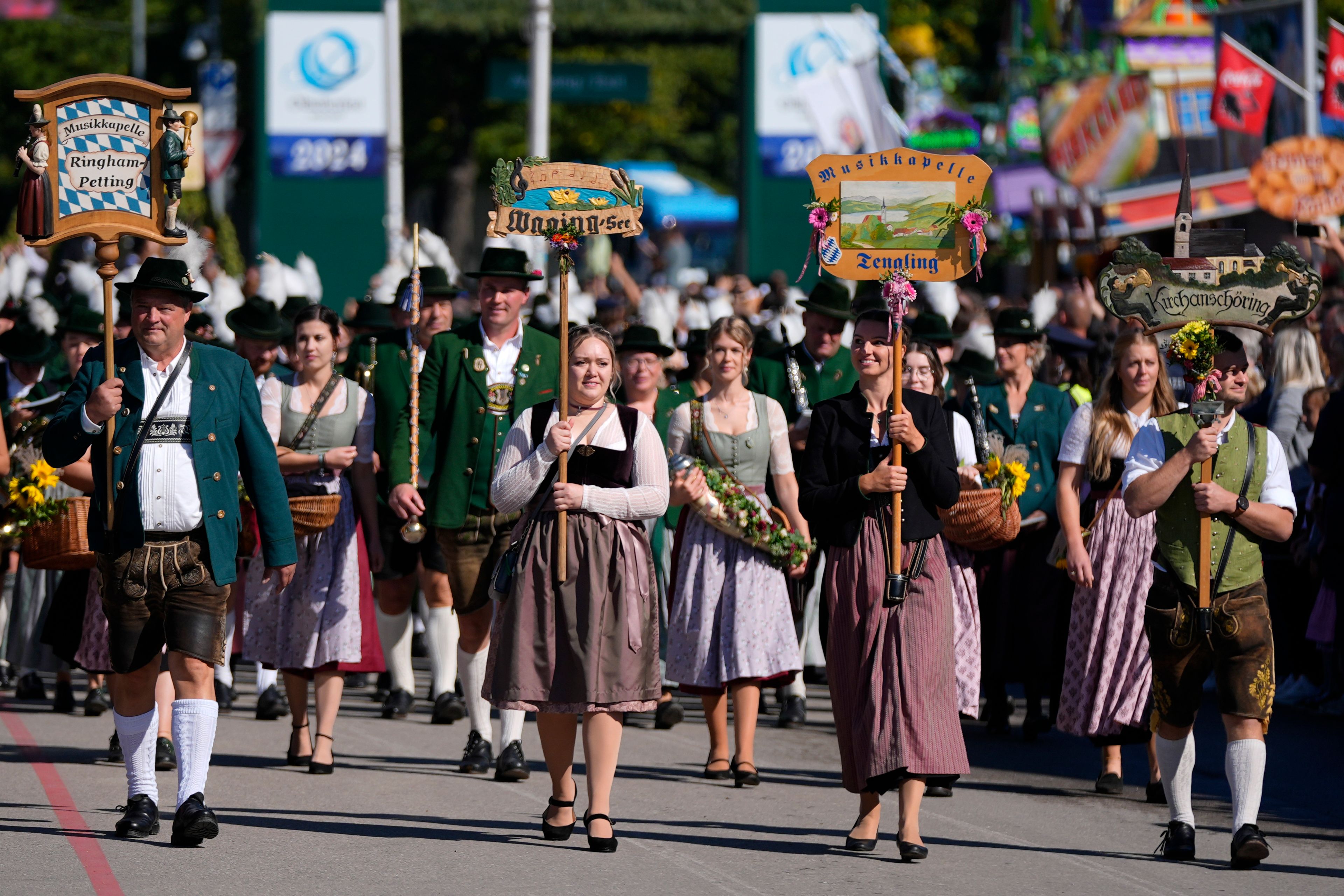 The traditional Oktoberfest music bands parade at the start of the 189th 'Oktoberfest' beer festival in Munich, Germany, Saturday, Sept. 21, 2024. (AP Photo/Matthias Schrader)