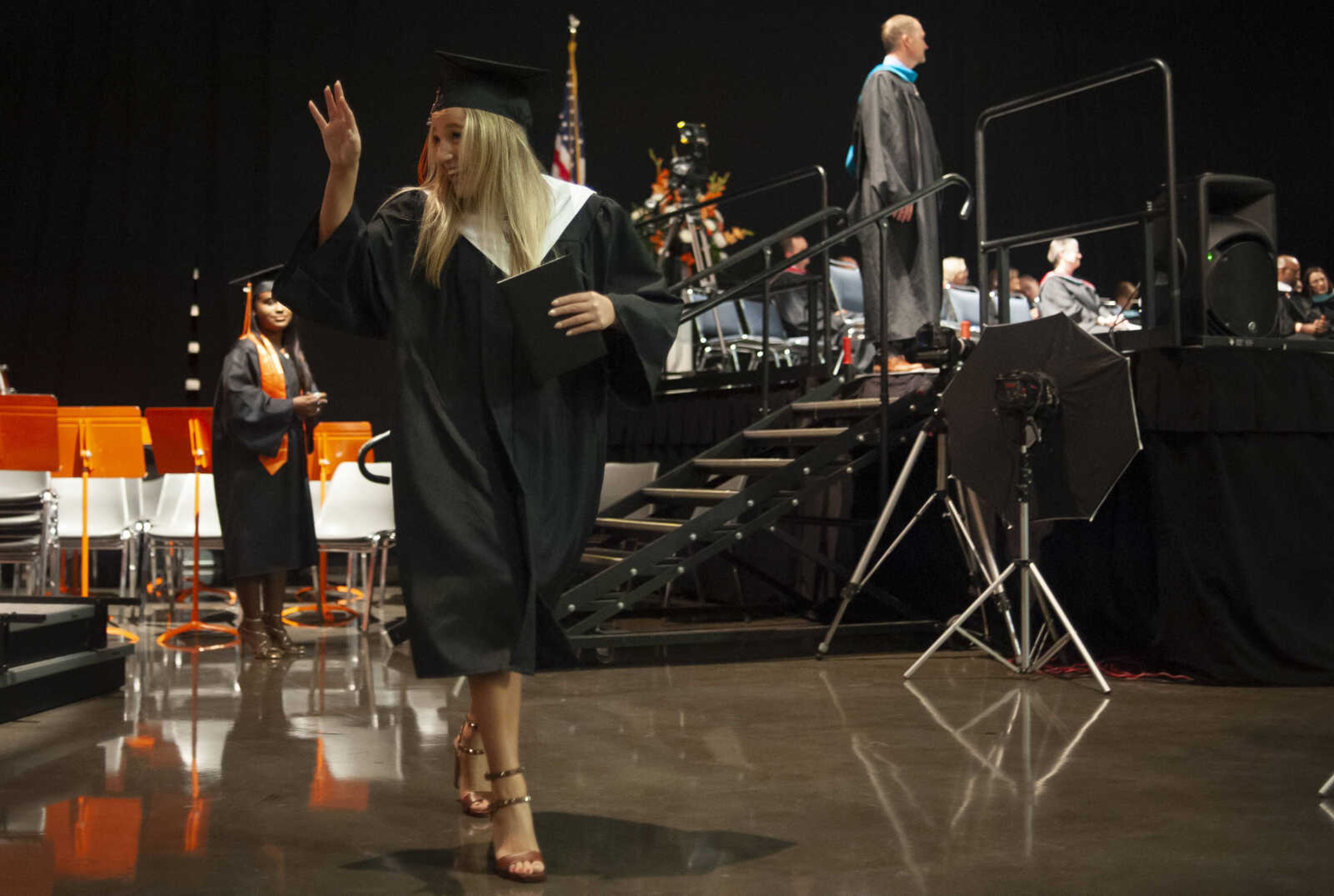 Cape Central's Shelby Norder waves after crossing the stage during Cape Central High School's Class of 2019 Commencement on Sunday, May 12, 2019, at the Show Me Center in Cape Girardeau.