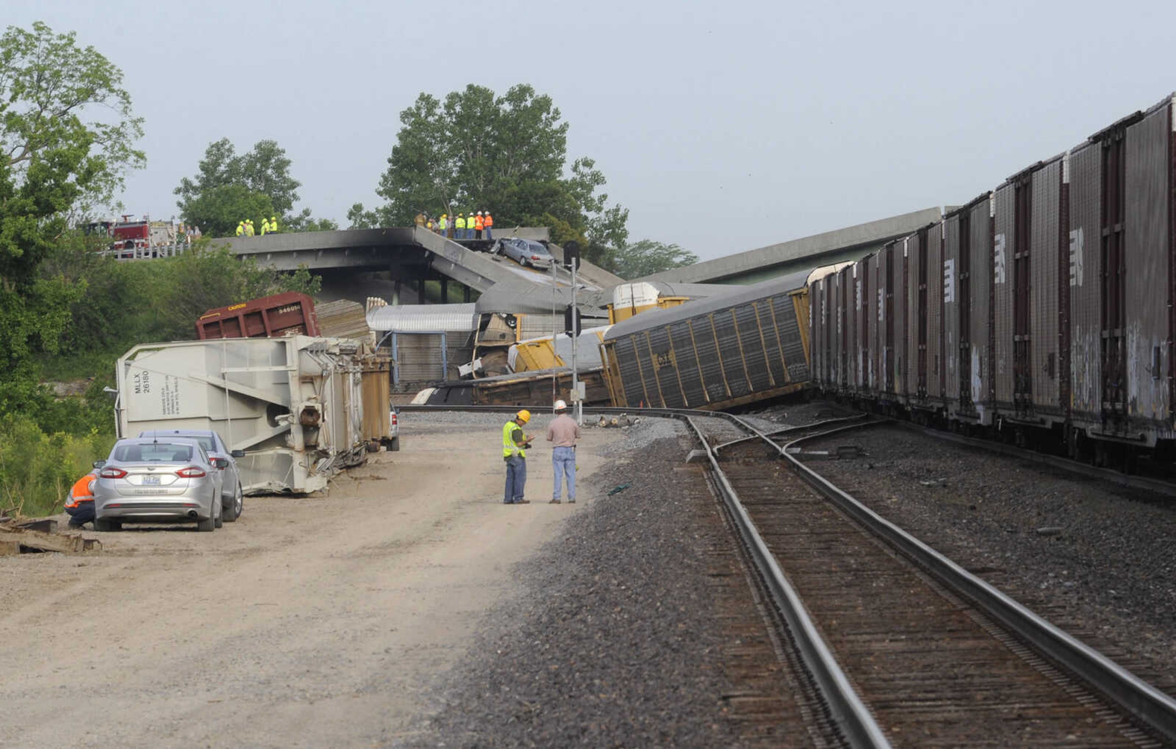 This scene just east of the Route M overpass shows several derailed train cars near Rockview, Mo. Saturday, May 25, 2013. (Fred Lynch)