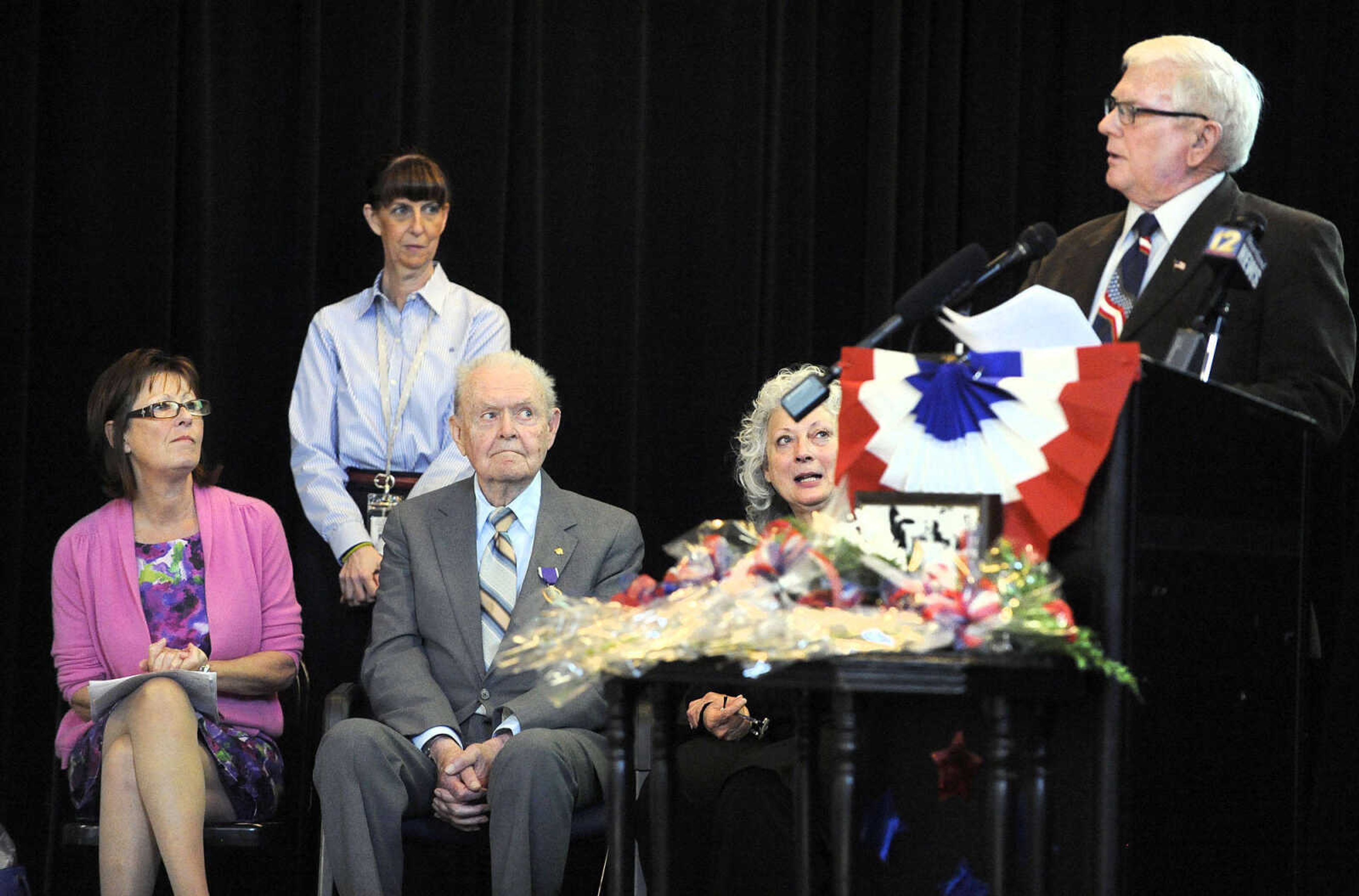 LAURA SIMON ~ lsimon@semissourian.com

From left, Diane Gomersall, Ruth Ann Orr, Sgt. Clifford Heinrich, and Linda Thompson listen as Master Sgt. David Hitt speaks on Monday, March 21, 2016, during the living history event honoring the WWII lost crew of the Flying Fortress 812, and the medal presentation to Sgt. Clifford Heinrich at Alma Schrader Elementary.