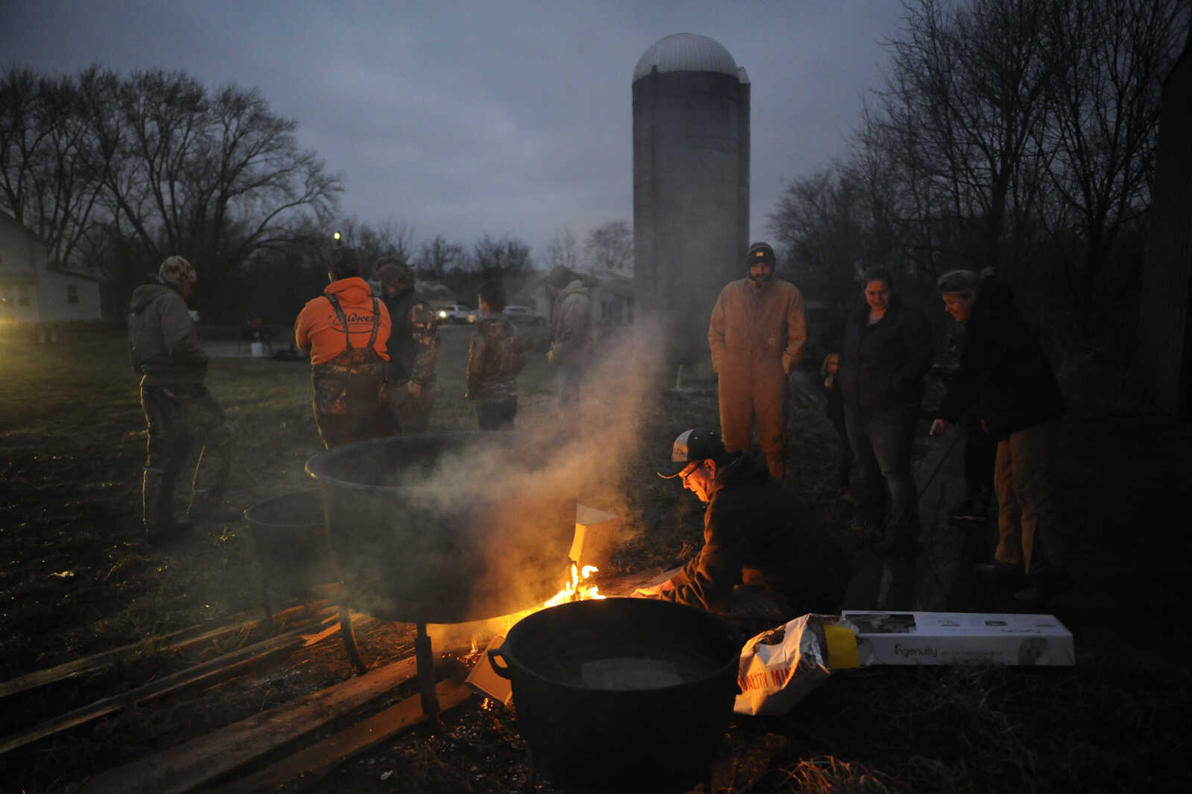 For the Hotop family, hog butchering is a decades-old tradition passed down from generation to generation. Paul Hotop said his late father, Rueben Hotop, taught him how to butcher and his father taught him. "It's something our dad did whenever he was young, he taught us to do it and now I'm teaching my boys to do it," Paul said. "Not many people do it anymore. We like to know where our meat comes from." Paul's brother Allen Hotop of Apple Creek, Missouri, said the family always picks the same weekend, the one before the Super Bowl, each year to butcher. This year was no exception as numerous family members gathered Jan. 25 to butcher seven hogs on a farm in rural Perry County, Missouri. "Back when we was going up, we kind of had to do it cause mom and dad had 13 kids so it was, you know, anything we could do to keep us from going to the meat store is probably why dad did it," Paul said. Allen said the hog butchering was done before he was born in 1960. "I would say everybody used to do it out of necessity and now it's done as a novelty," Allen said of the butchering. "This is a Hotop tradition." Pictured here:&nbsp;Ronnie Hotop of Perryville, Missouri, lights a fire shortly prior to 7 a.m. before the start of hog butchering Saturday, Jan. 25, 2020, on a farm in rural Perry County, Missouri. Published March 2.