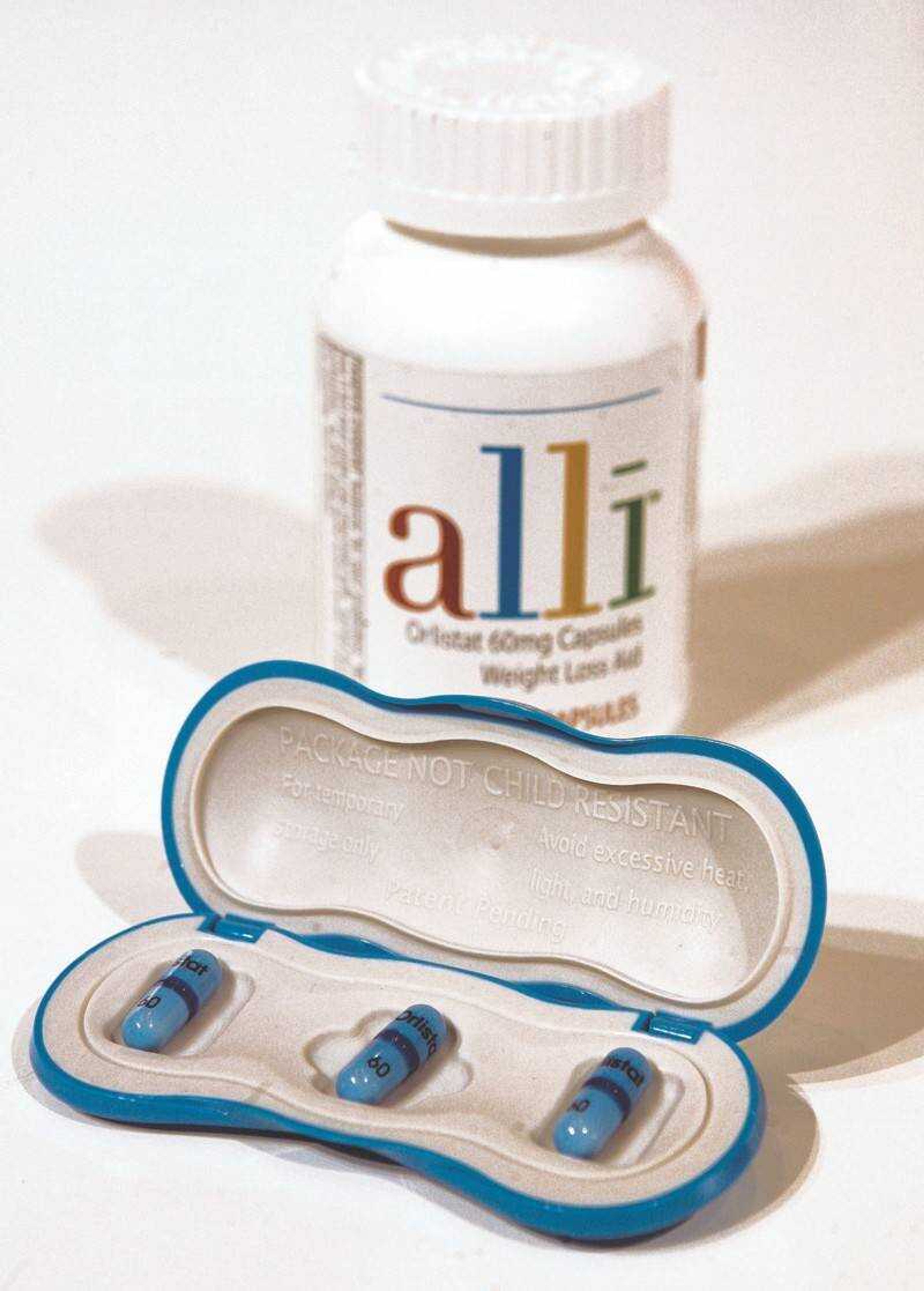 GlaxoSmithKline's alli, the first over-the-counter diet pill approved by the Food and Drug Administration, is photographed in New York, Tuesday, May 22, 2007. In clinical trials, the FDA says that people using alli lost an additional 2 to 3 pounds for every 5 pounds lost through diet and exercise. (AP Photo/Richard Drew)