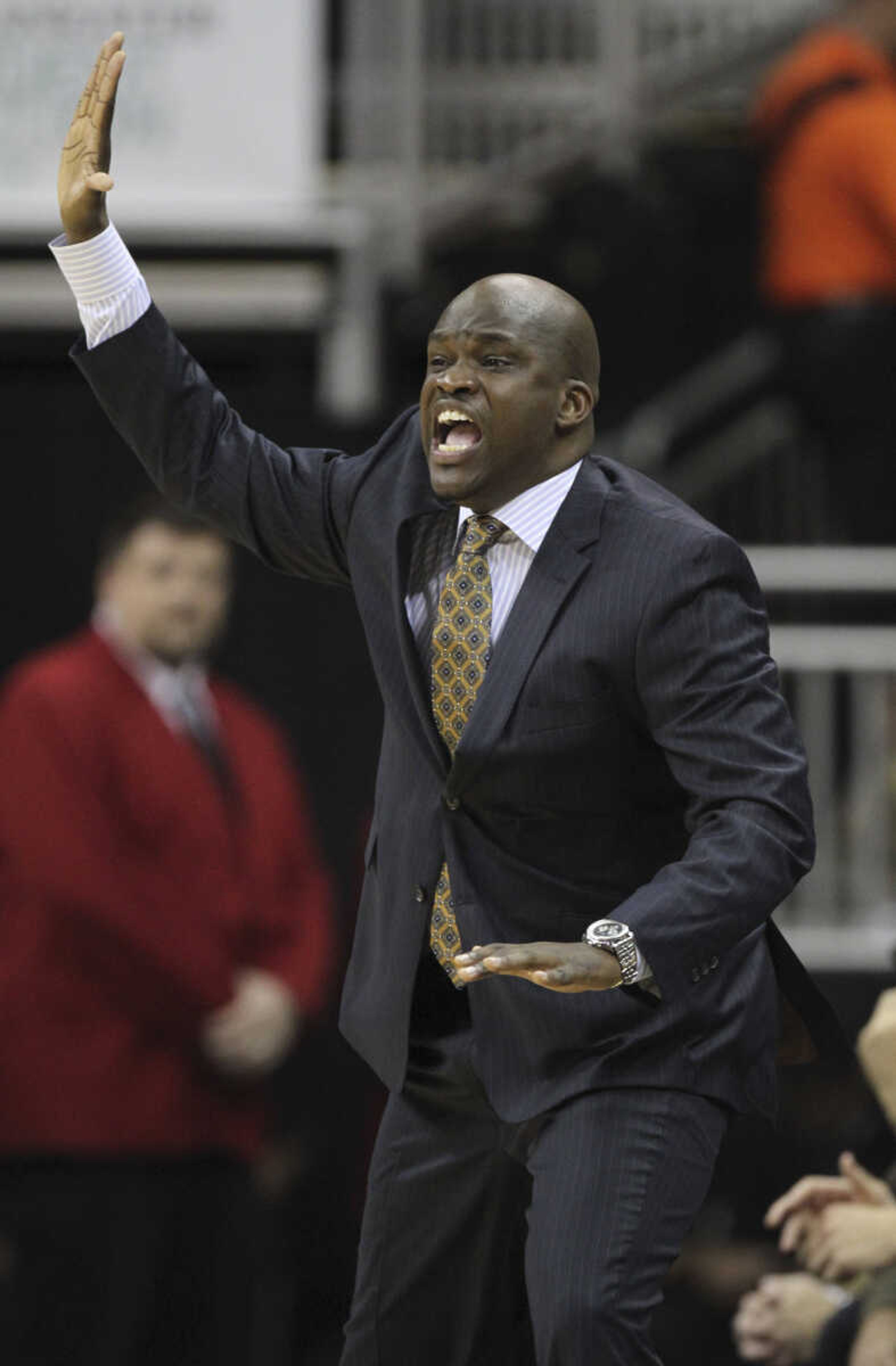 Then Missouri associate head coach Tim Fuller directs the team during the first half of 2013 game against Hawaii, Saturday, Nov. 16, 2013, in Kansas City, Mo. (AP Photo/Ed Zurga)