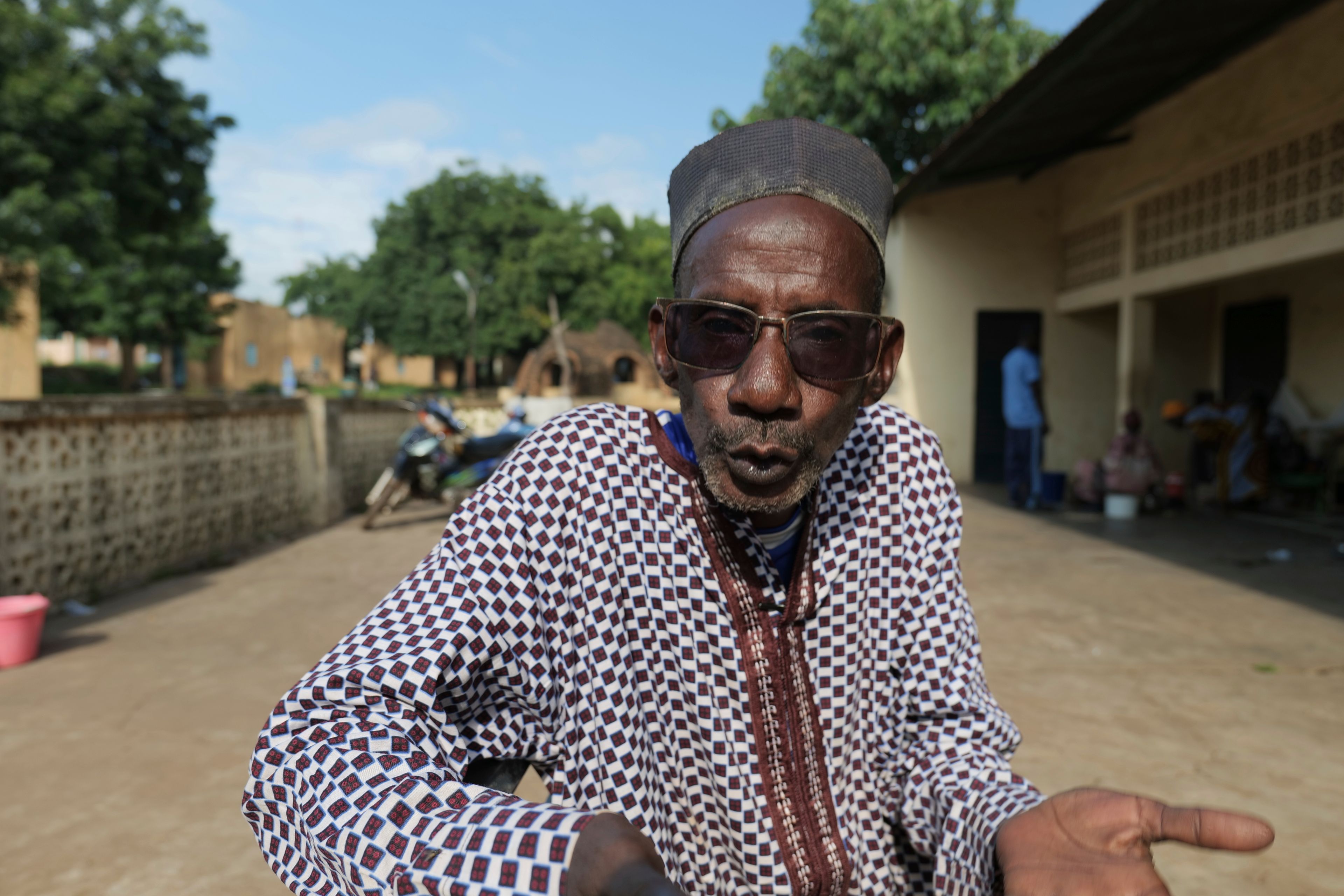 Adama Bagayoko, director of the theater troupe that has been performing with patients at the psychiatric ward of the Point G hospital, stands in the hospital's courtyard in Bamako, Mali, Friday, Sept. 20, 2024. (AP Photo/Moustapha Diallo)