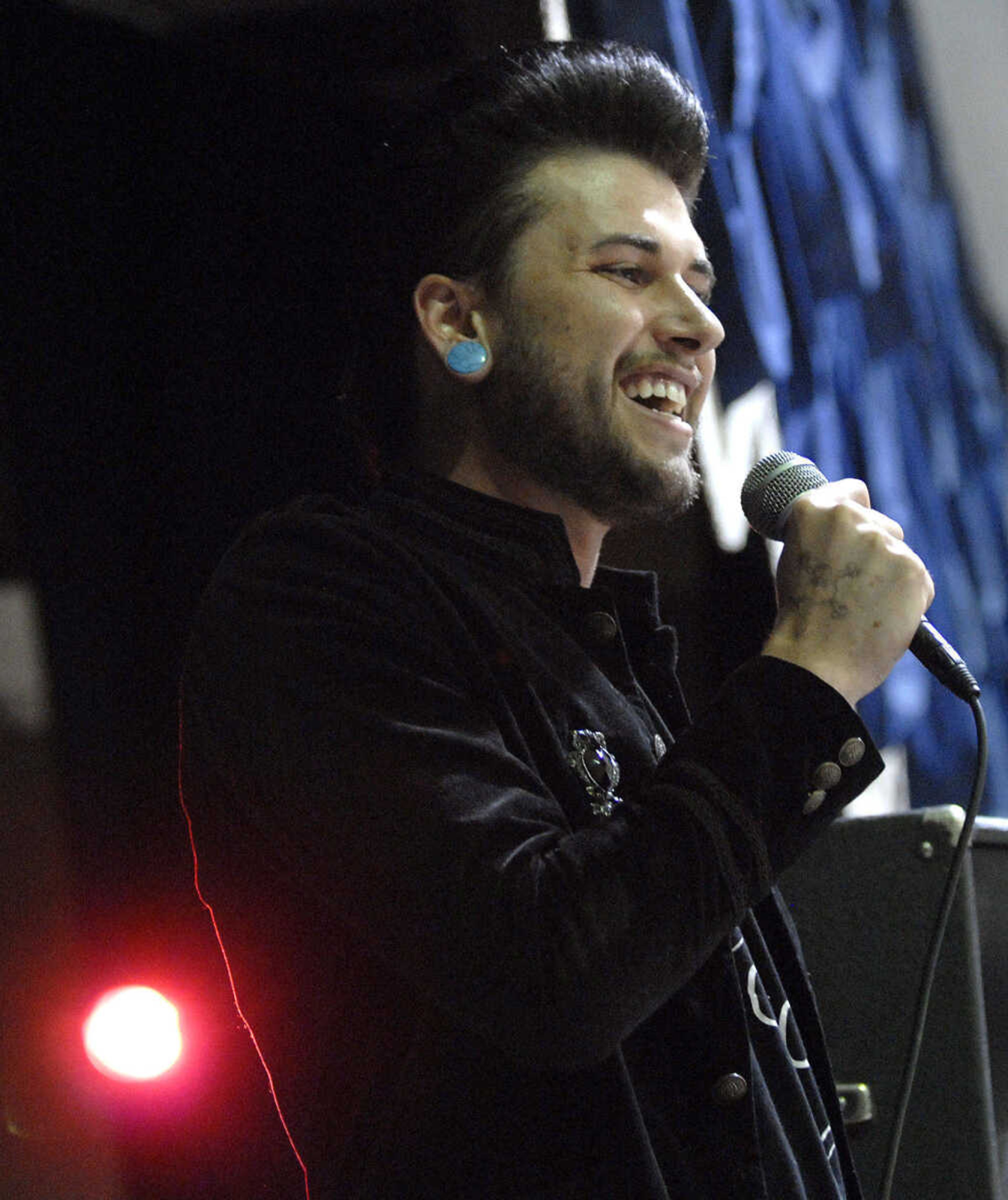 LAURA SIMON~lsimon@semissourian.com
Josh Spangler sings the National Anthem before the Cape Girardeau Roller Girls take on the Southern Illinois Roller Girls Saturday, February 26, 2011 during  Riot at the CG Corral at the A.C. Brase Arena Building in Cape Girardeau.