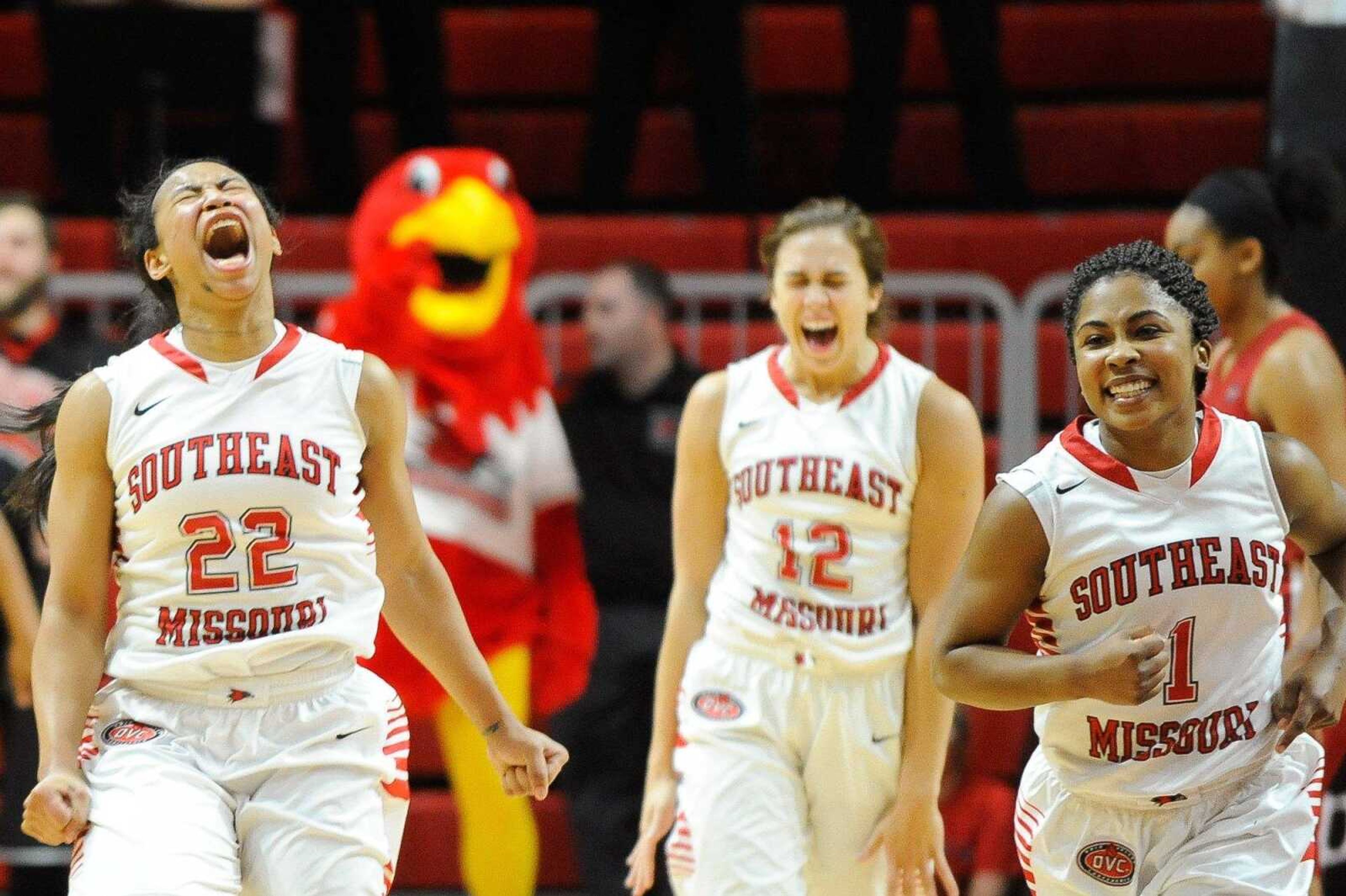 Southeast Missouri State's Deja Jones (22), Erin Bollmann (12) and Bri Mitchell celebrate their victory over Austin Peay on Saturday at the Show Me Center. The Redhawks won 71-69.