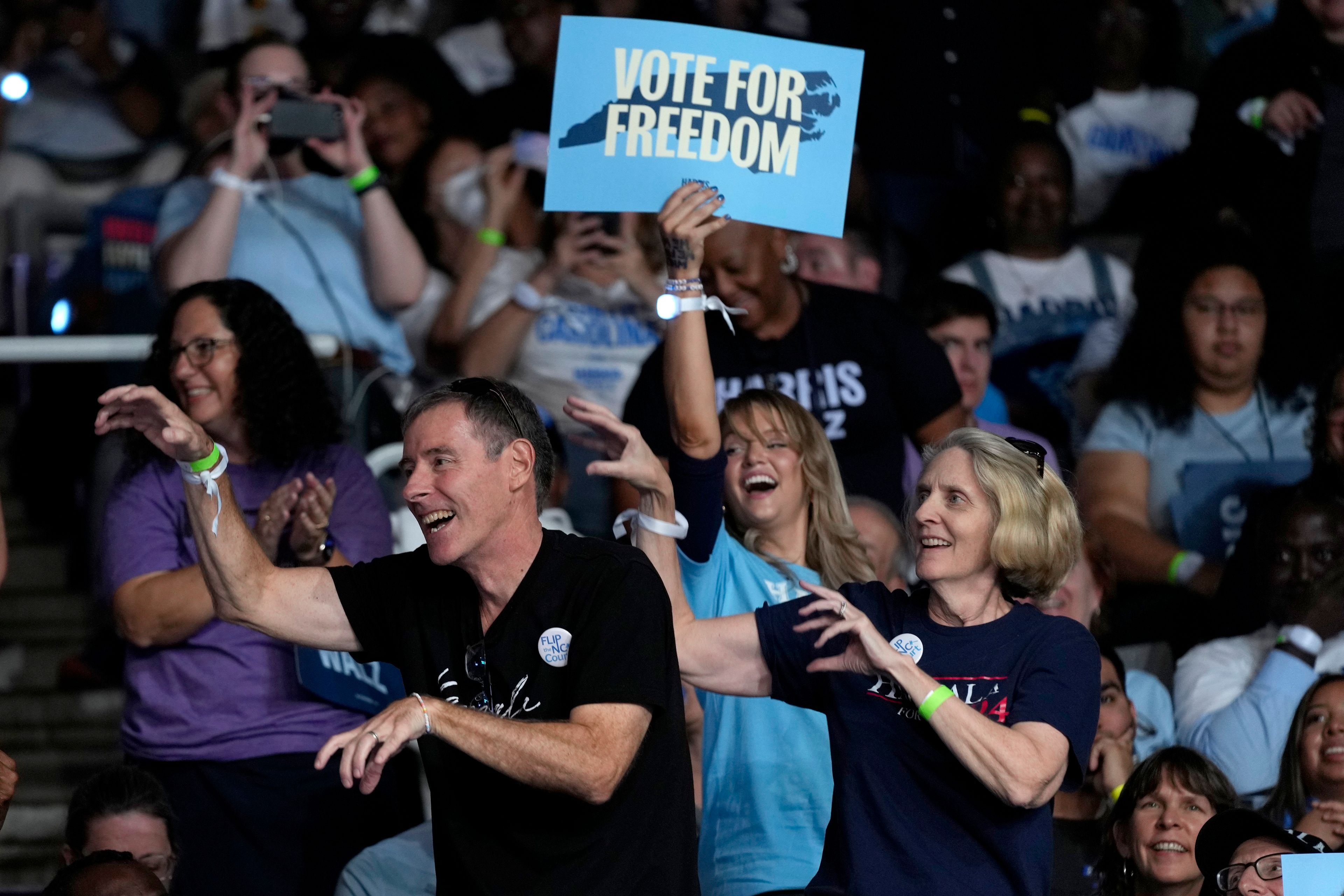 Attendees dance to the song "Thriller" before Democratic presidential nominee Vice President Kamala Harris arrives to speak at a campaign rally at East Carolina University in Greenville, N.C., Sunday, Oct. 13, 2024. (AP Photo/Susan Walsh)