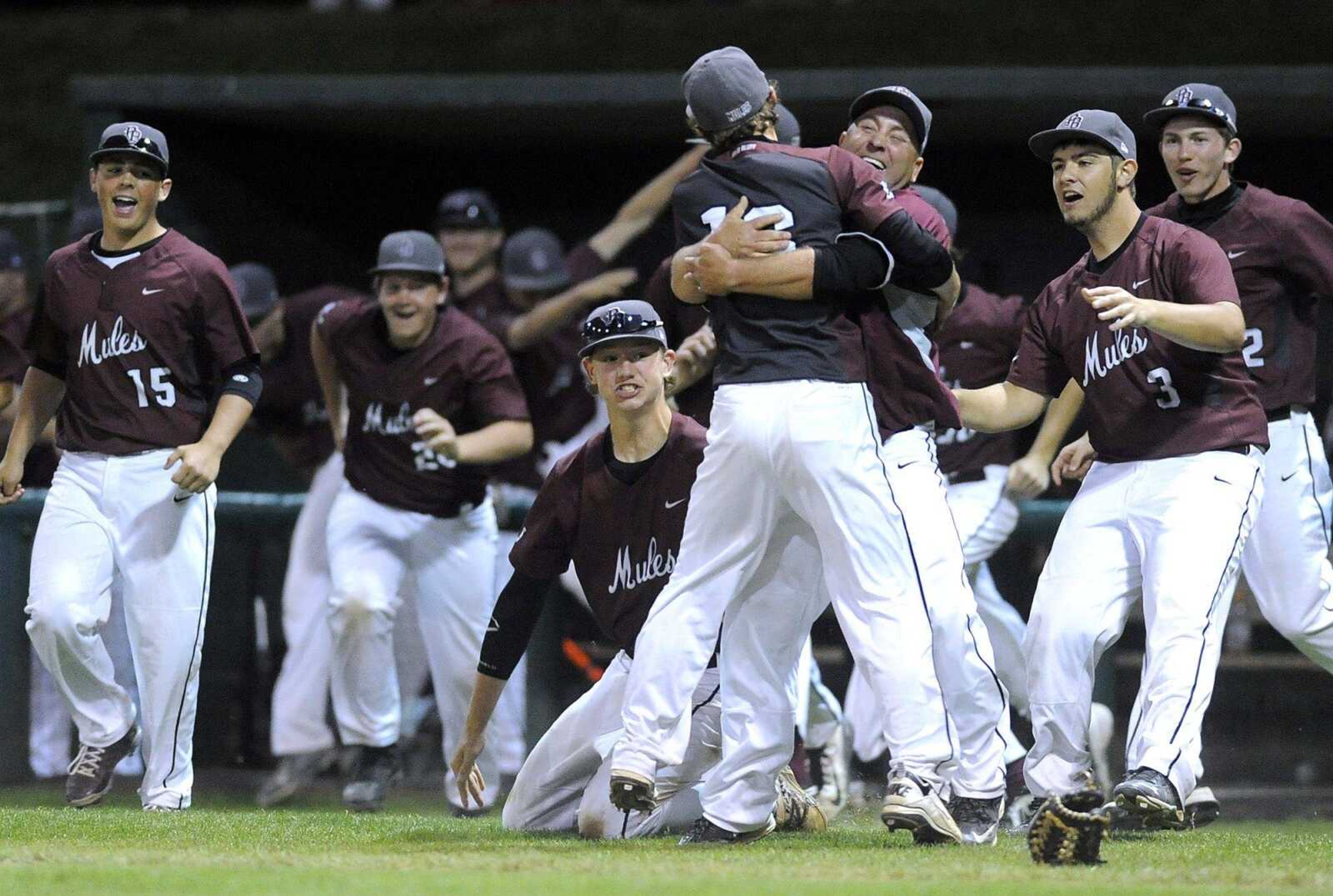 Poplar Bluff players run out to celebrate with relief pitcher Jared Moses after defeating Notre Dame 4-2 in the championship game of the SEMO Conference Tournament Monday, May 4, 2015 at Capaha Field. (Fred Lynch)