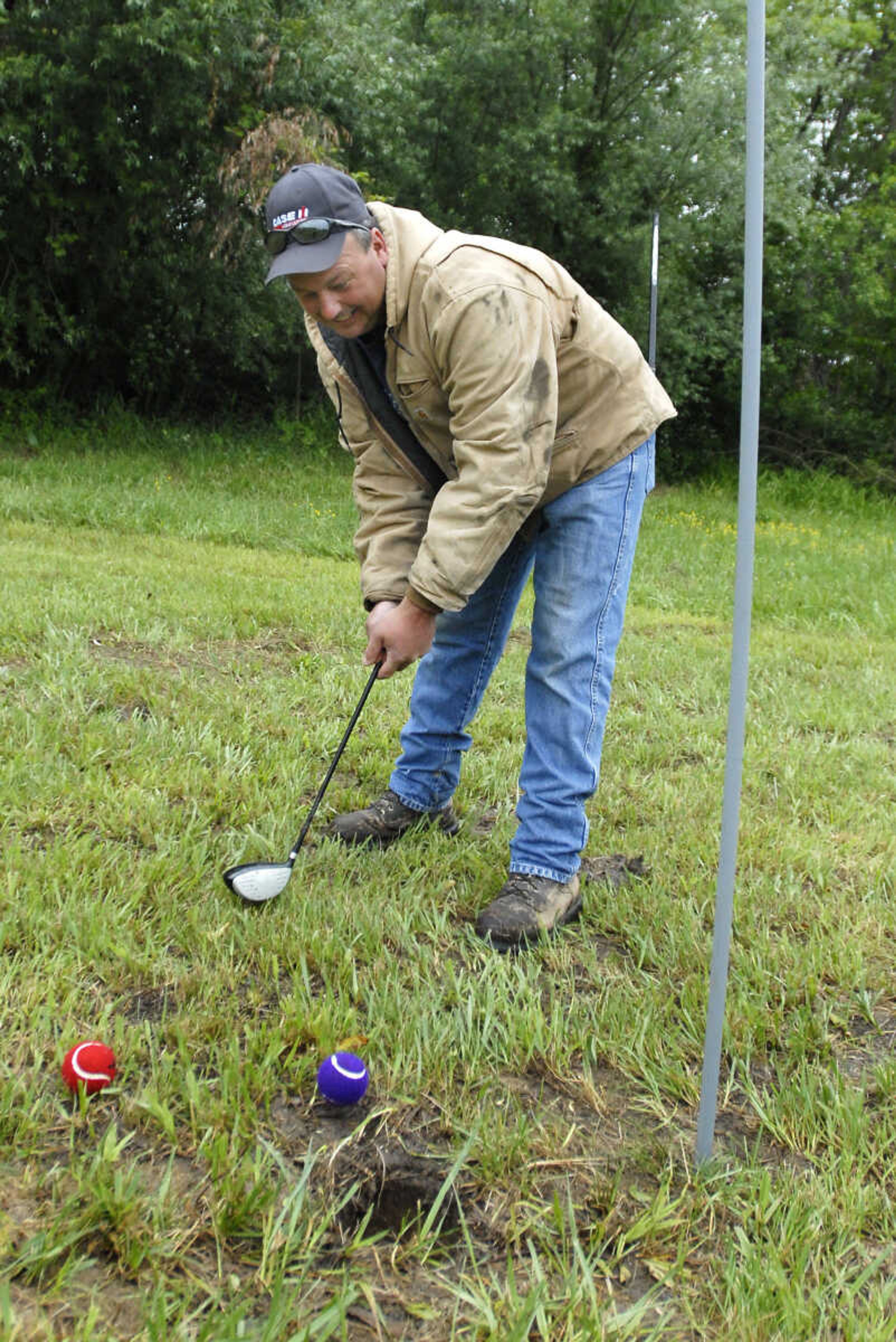 KRISTIN EBERTS ~ keberts@semissourian.com

Jody Haupt uses a half-sized club to make a putt during the Kow Pasture Klassic at Schlinder's Tavern in New Hamburg, Mo., on Saturday, May 14, 2011. Proceeds from the event benefit the Kenny Rogers Children's Center and the Missouri Veterans Home.