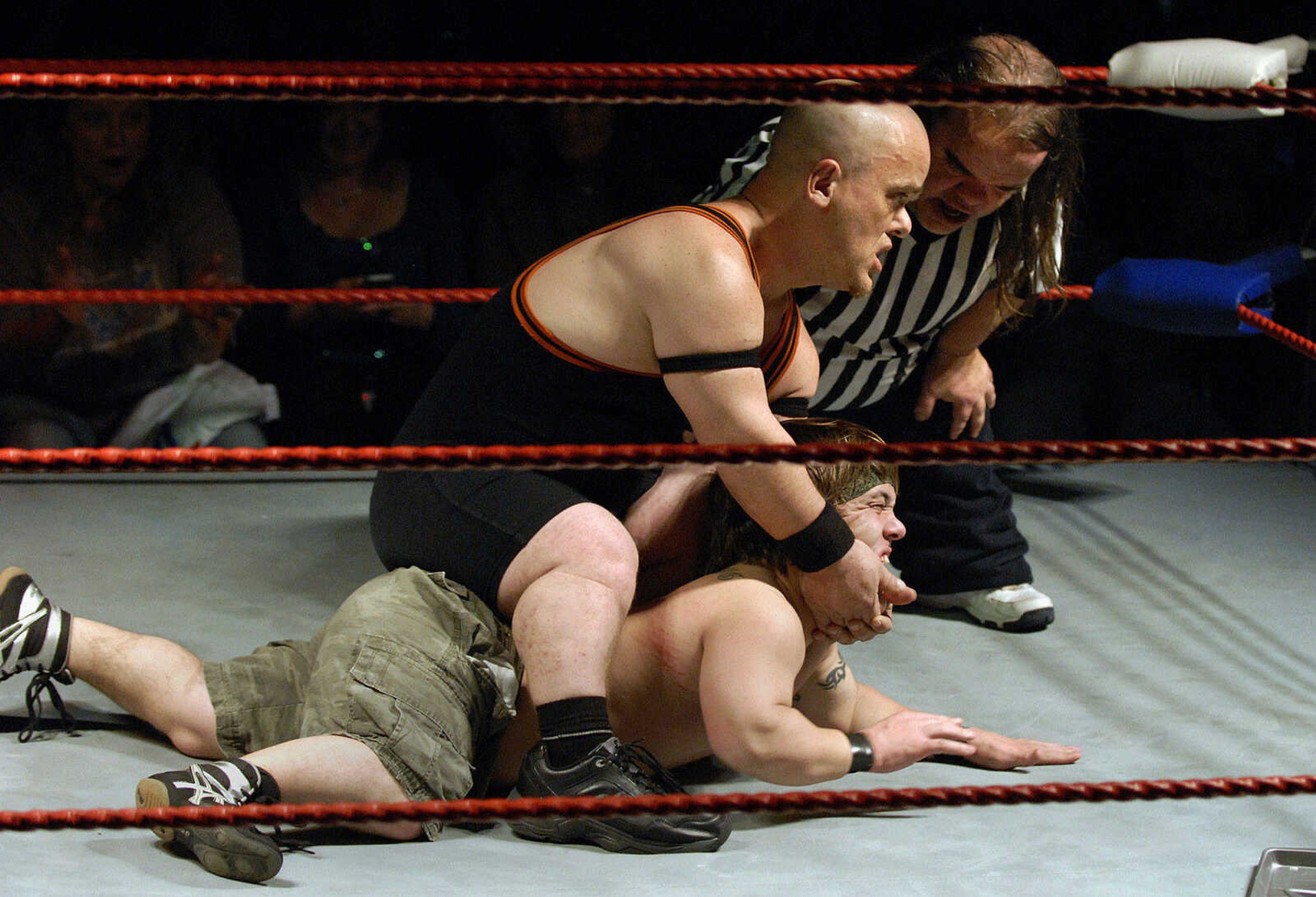 LAURA SIMON~lsimon@semissourian.com
"Bad Boy Brian" pins down "Little Rambo" as referee "Meatloaf" counts the seconds of the hold Thursday, February 24, 2011 during a sold out Champion Midget Wrestling match at the Pink Galleon in Cape Girardeau.