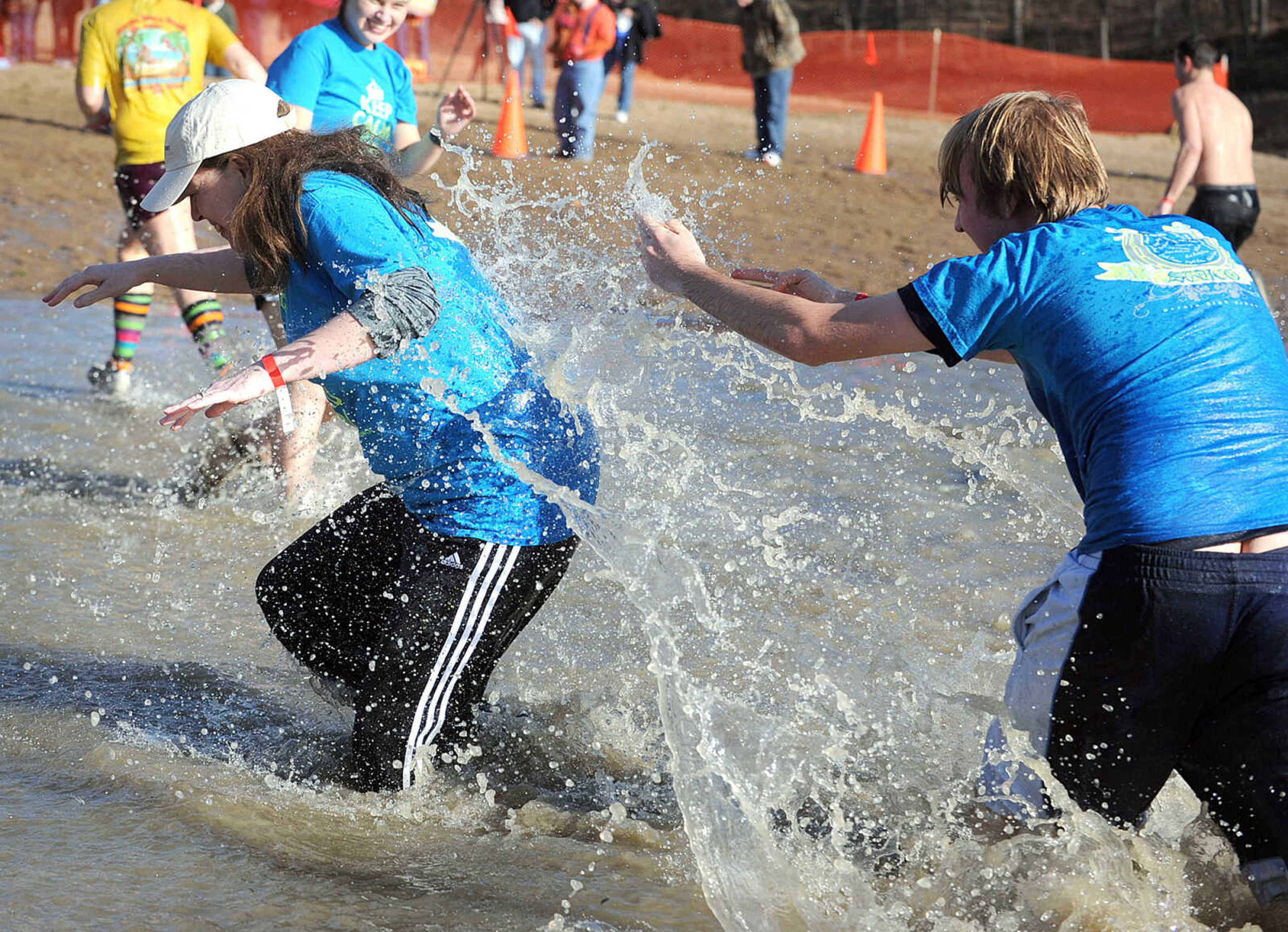 LAURA SIMON ~ lsimon@semissourian.com
People plunge into the cold waters of Lake Boutin Saturday afternoon, Feb. 2, 2013 during the Polar Plunge at Trail of Tears State Park. Thirty-six teams totaling 291 people took the annual plunge that benefits Special Olympics Missouri.