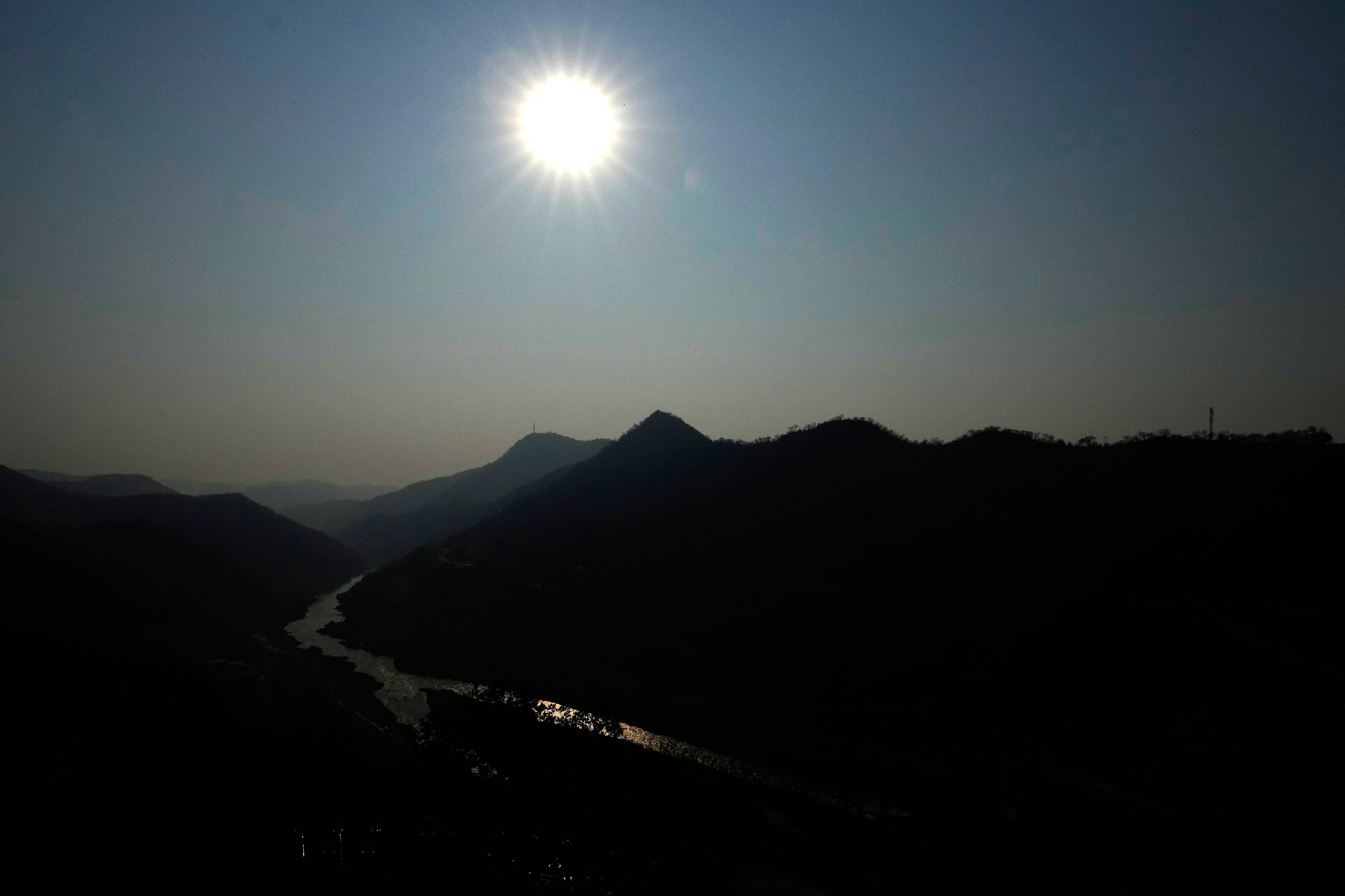 The sun rises near Kariba dam in Siavonga, Zambia, Thursday, Sept. 19, 2024. (AP Photo/Themba Hadebe)