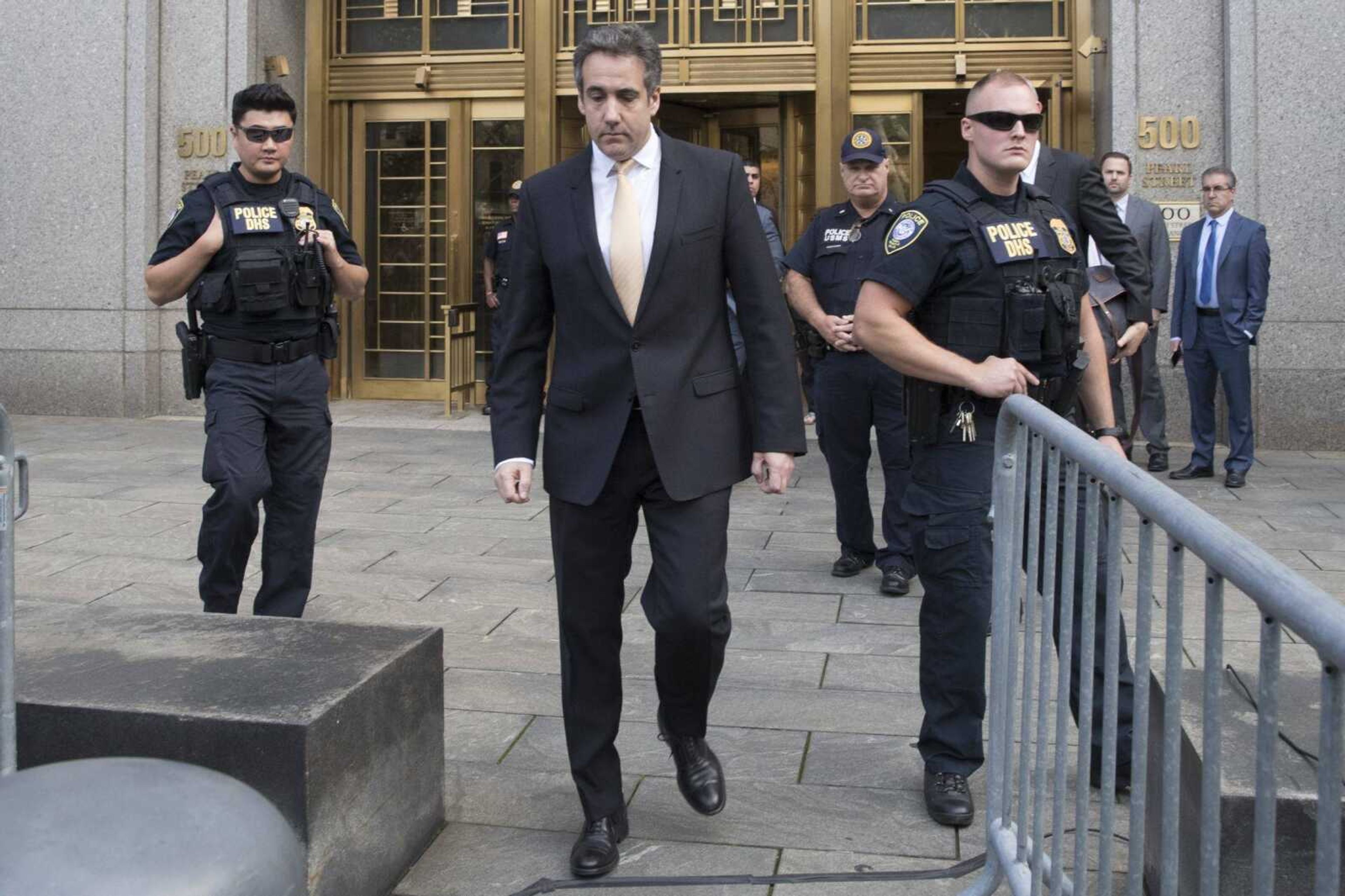 Michael Cohen, center, leaves federal court Aug. 18 in New York. President Donald Trump has long demanded loyalty from his friends and associates, but he has been learning the hard way in politics those relationships come and go.