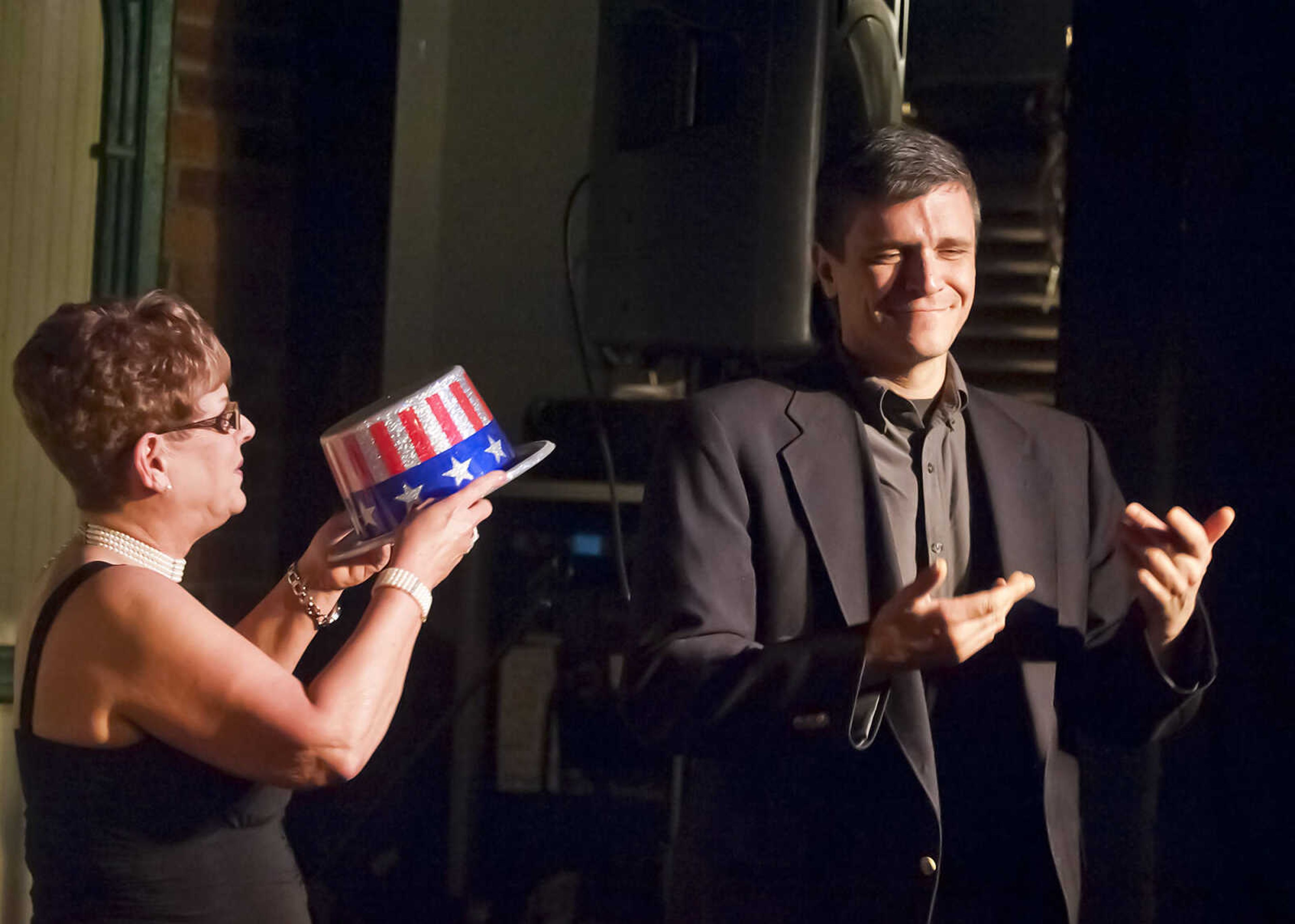 Debbie Barnhouse, left, president of the River City Players' board of directors, presents Paul King with the King of the Theater Award during the Abbott Awards, the River City Players' annual awards ceremony, Saturday, Jan. 18, at Port Cape in downtown Cape Girardeau. Auditions for the first production of the 2014 season, "Quiet on the Set," will be held at 7 p.m. Jan. 29 and 30 at Port Cape.