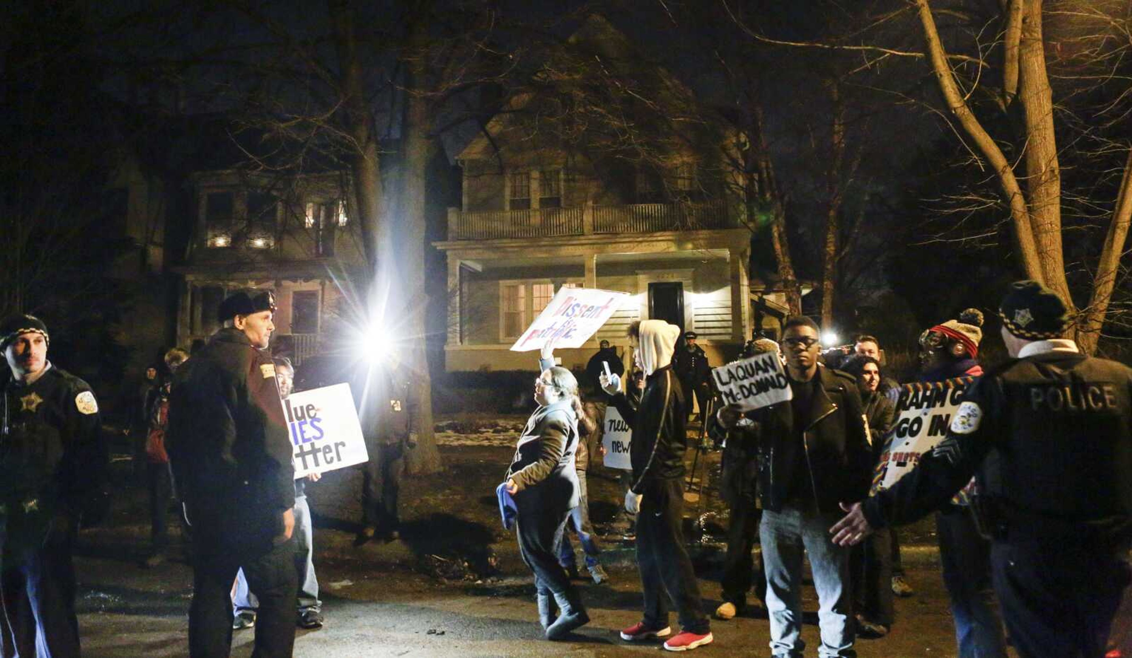 Protesters gather Thursday in front of the home of Chicago Mayor Rahm Emanuel after the release of video showing a 2013 fatal shooting of a 17-year-old black carjacking suspect by a white Chicago police officer. (Teresa Crawford ~ Associated Press)