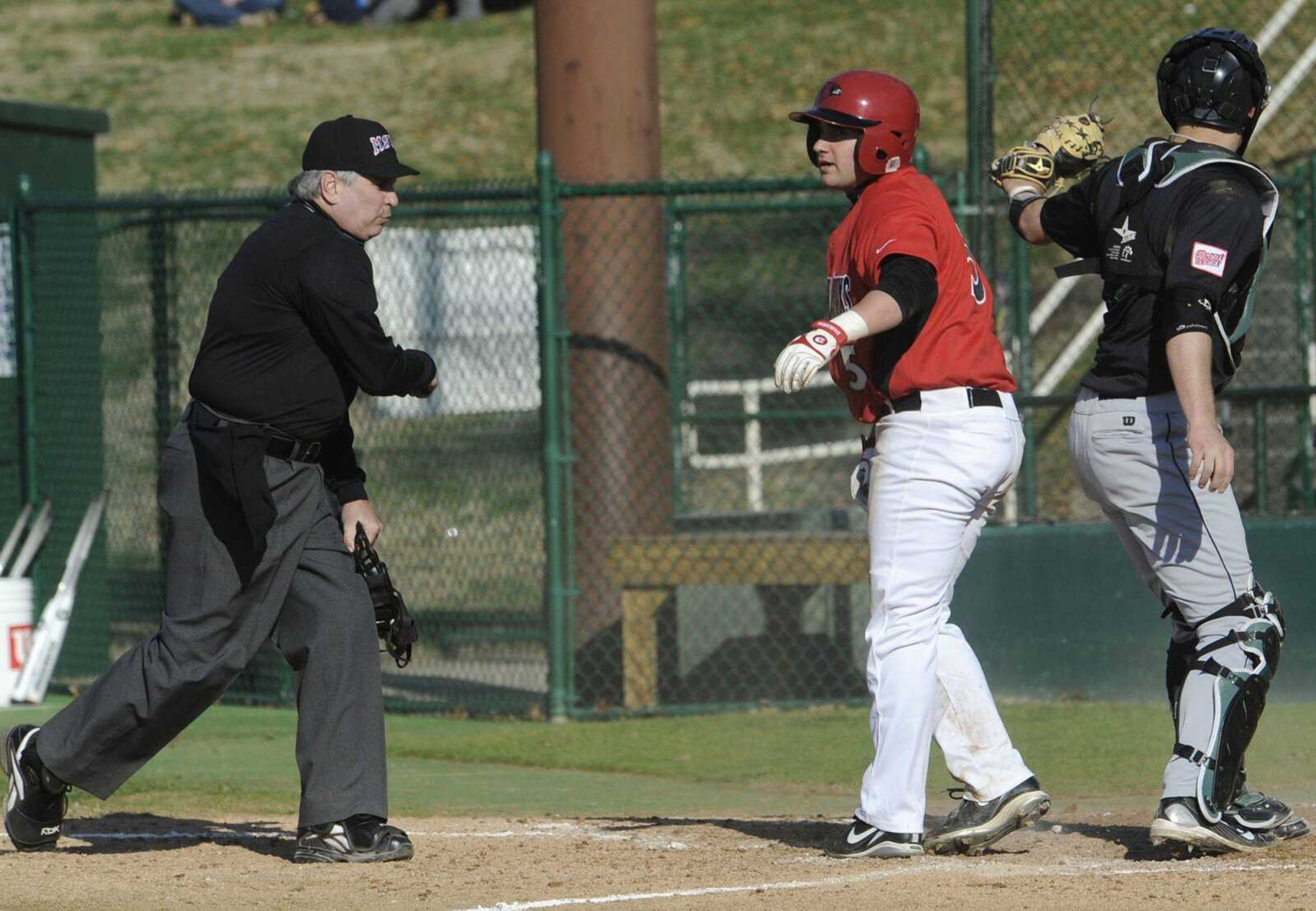 Southeast Missouri State's Taylor Heon is called out at the plate after getting caught in a rundown.